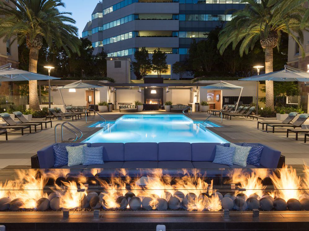 Swimming Pool and Sundeck with Outdoor Fire Pit and Lounge Seating