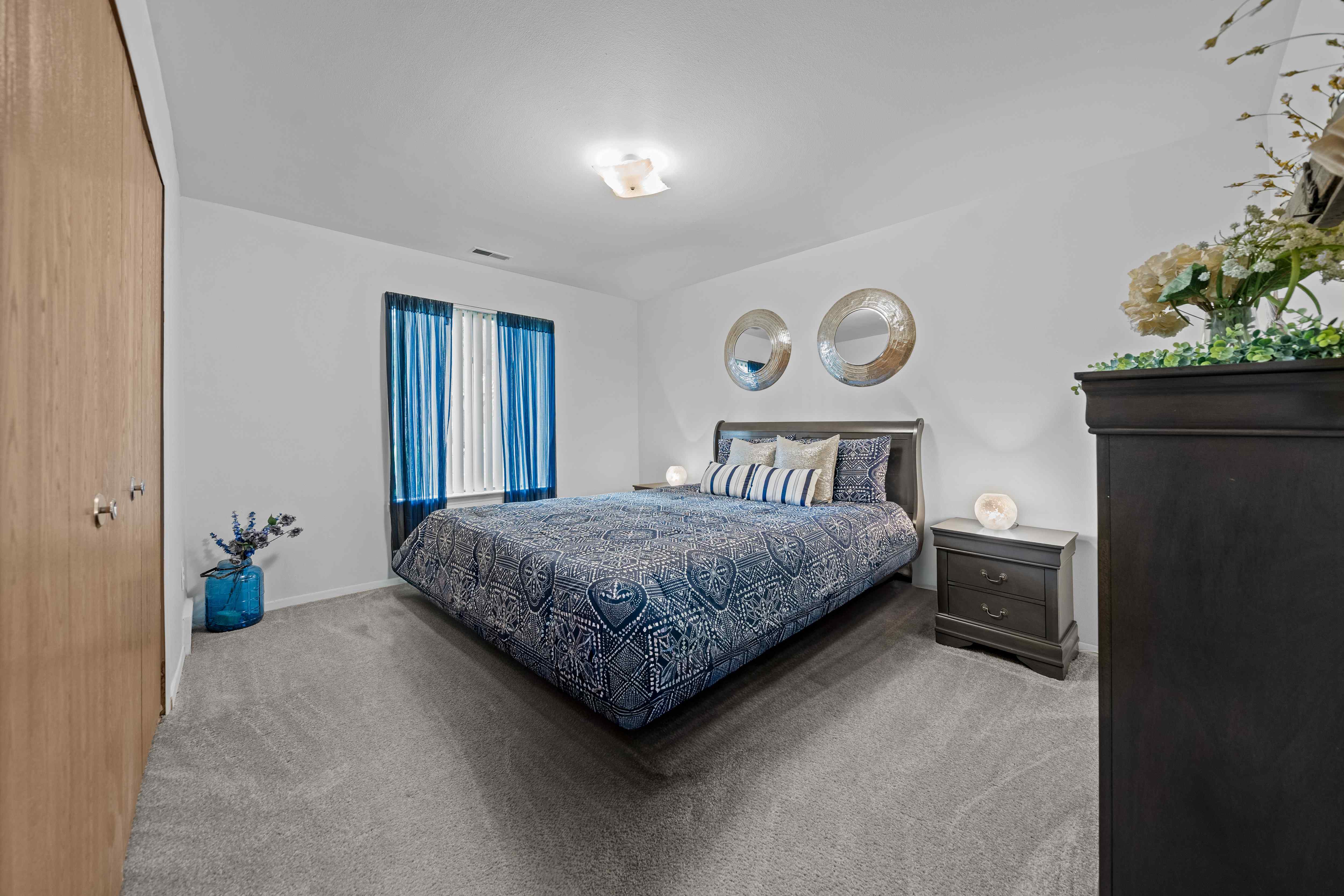 Cozy bedroom with natural light at Westwood Village Apartments in Westland, MI
