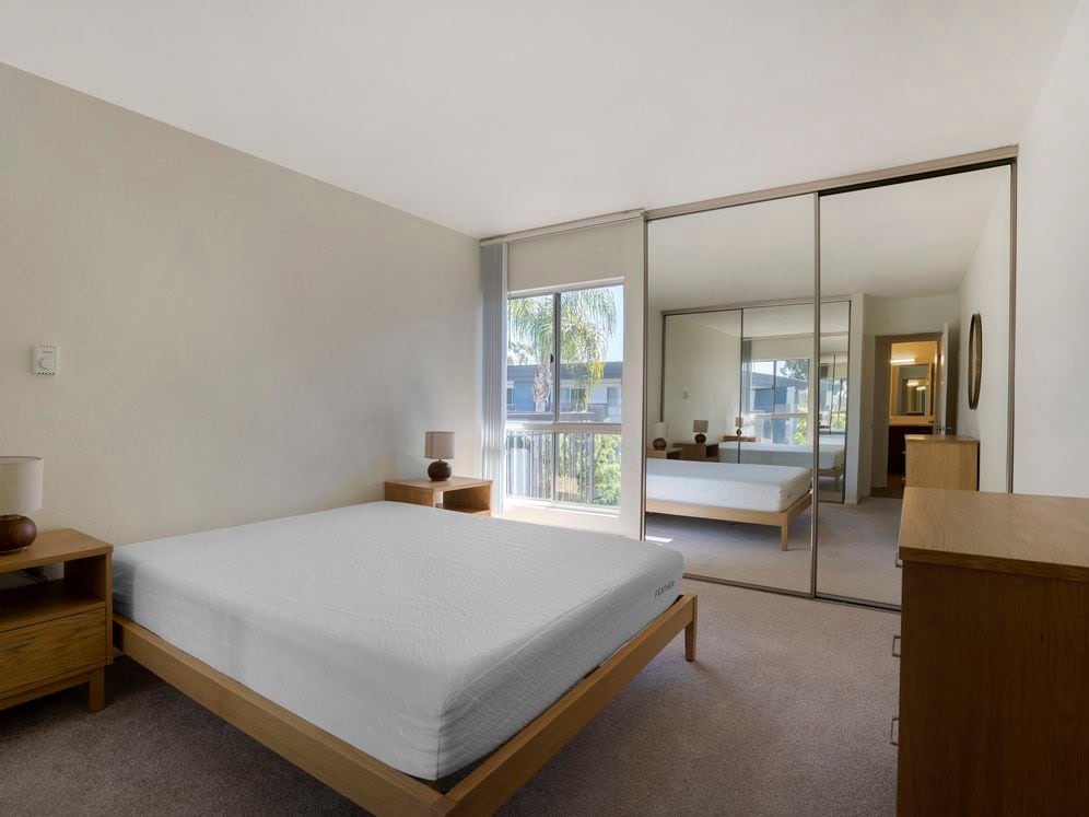 Furnished+ apartment homes feature queen bed with mattress, dresser, nightstands, and lamps.(Representative Image – exact items and style of furnishings may vary)