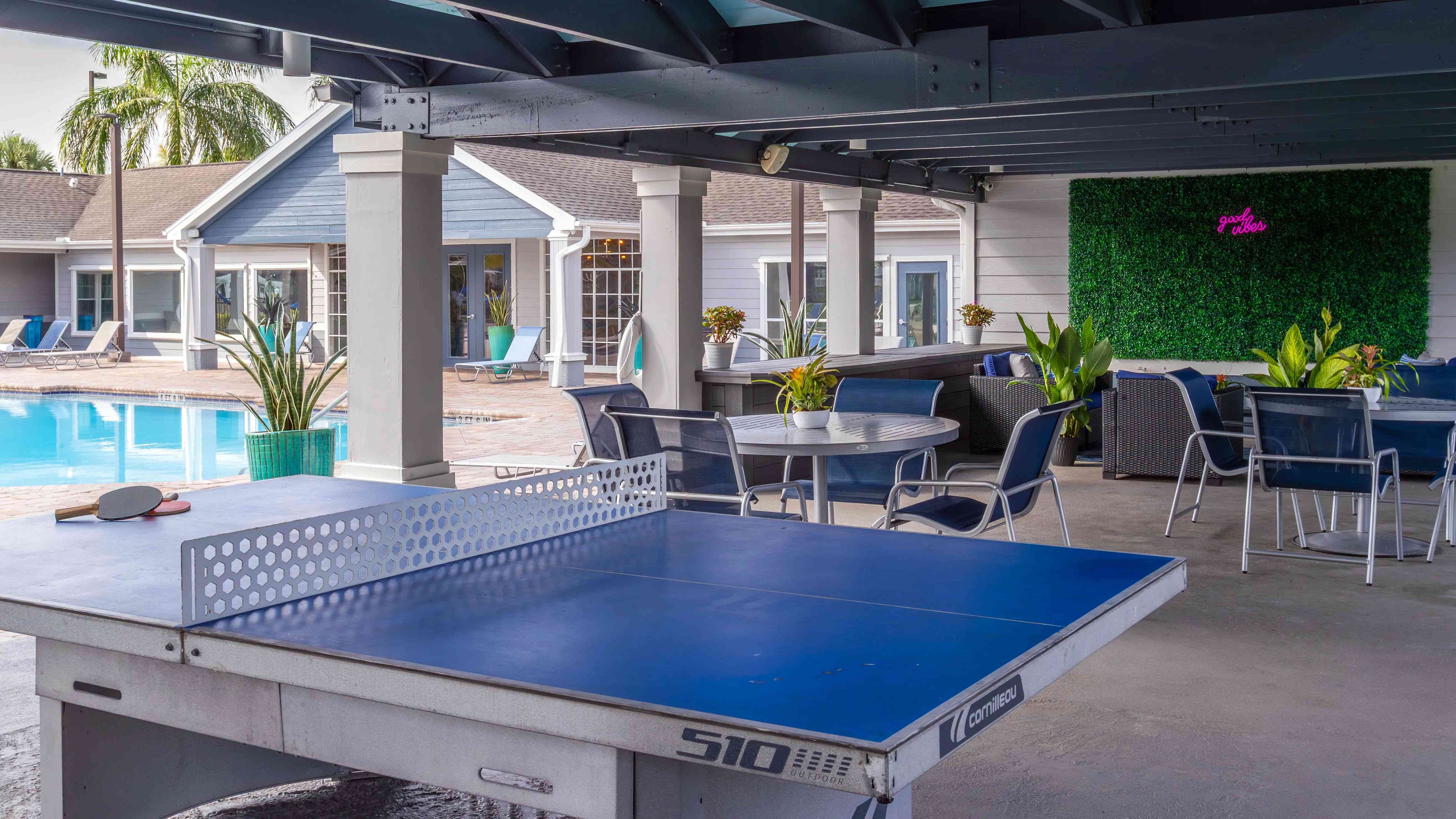 Enjoy the perfect mix of leisure and fun with poolside ping pong, shaded seating, and lush tropical surroundings.