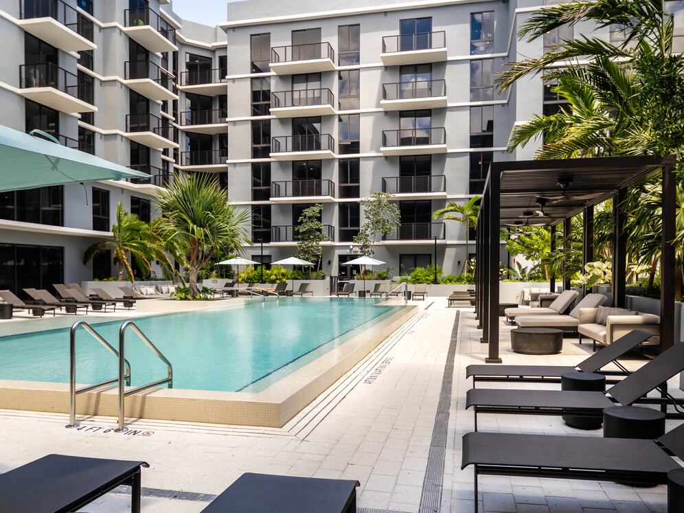 Resort-style pool with sundeck and cabanas