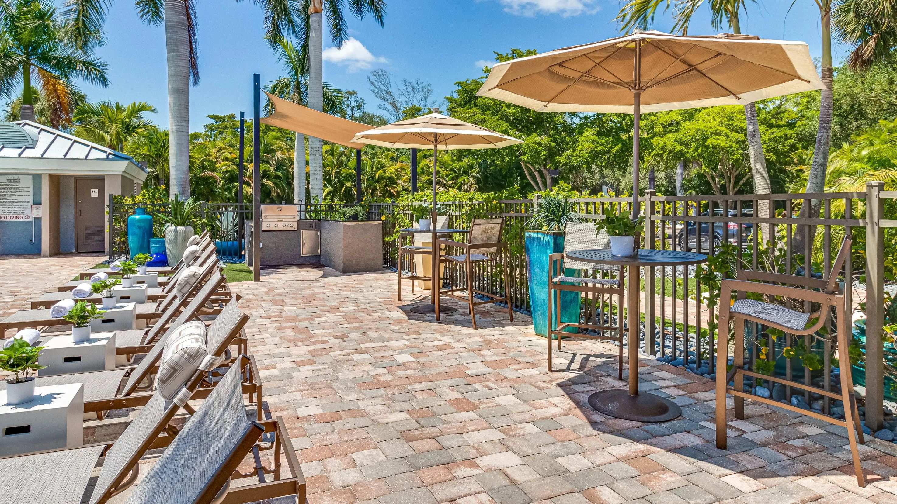 Immerse yourself in the joy of cooking at our poolside outdoor kitchen, a delightful al fresco culinary adventure. 