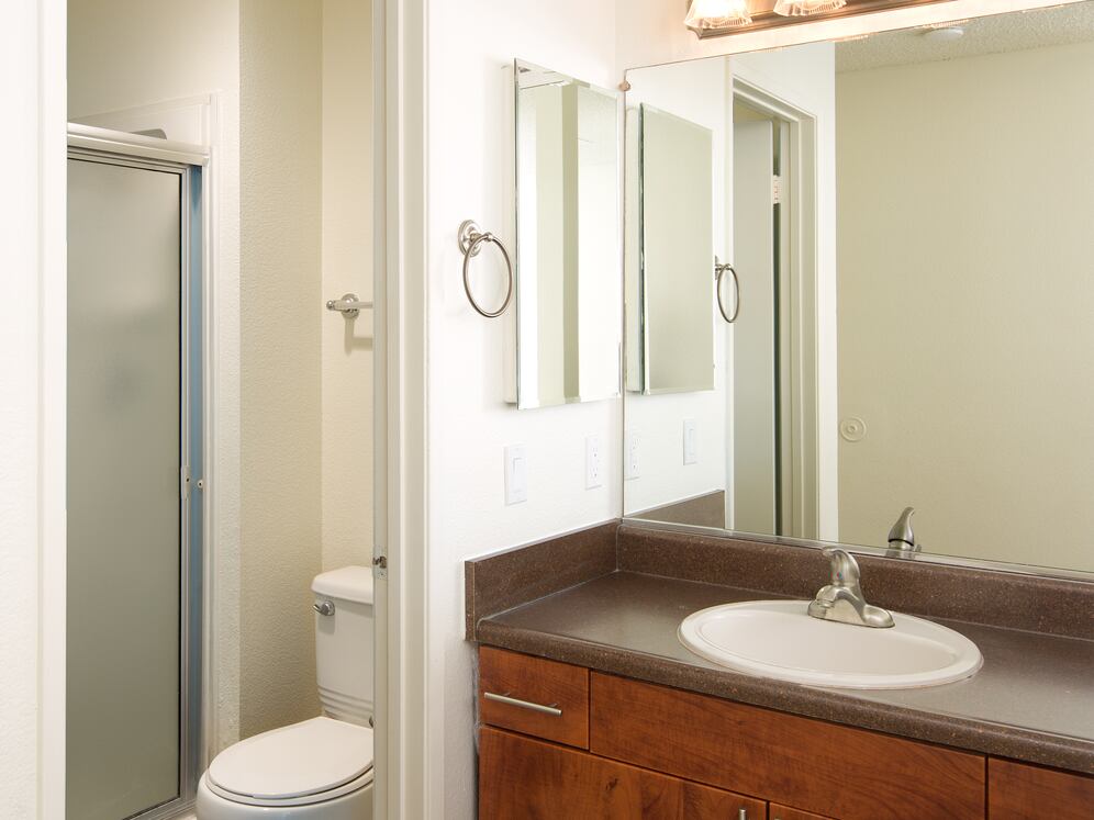 Classic Package I bath with laminate countertop, cherry cabinetry, and hard-surface flooring