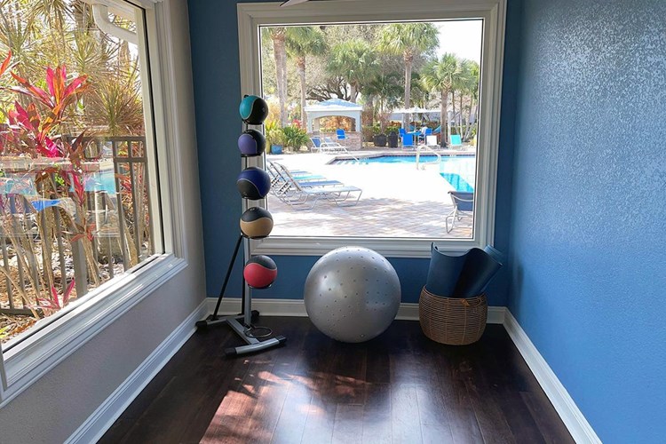 Our fitness center also features a yoga area overlooking the pool.