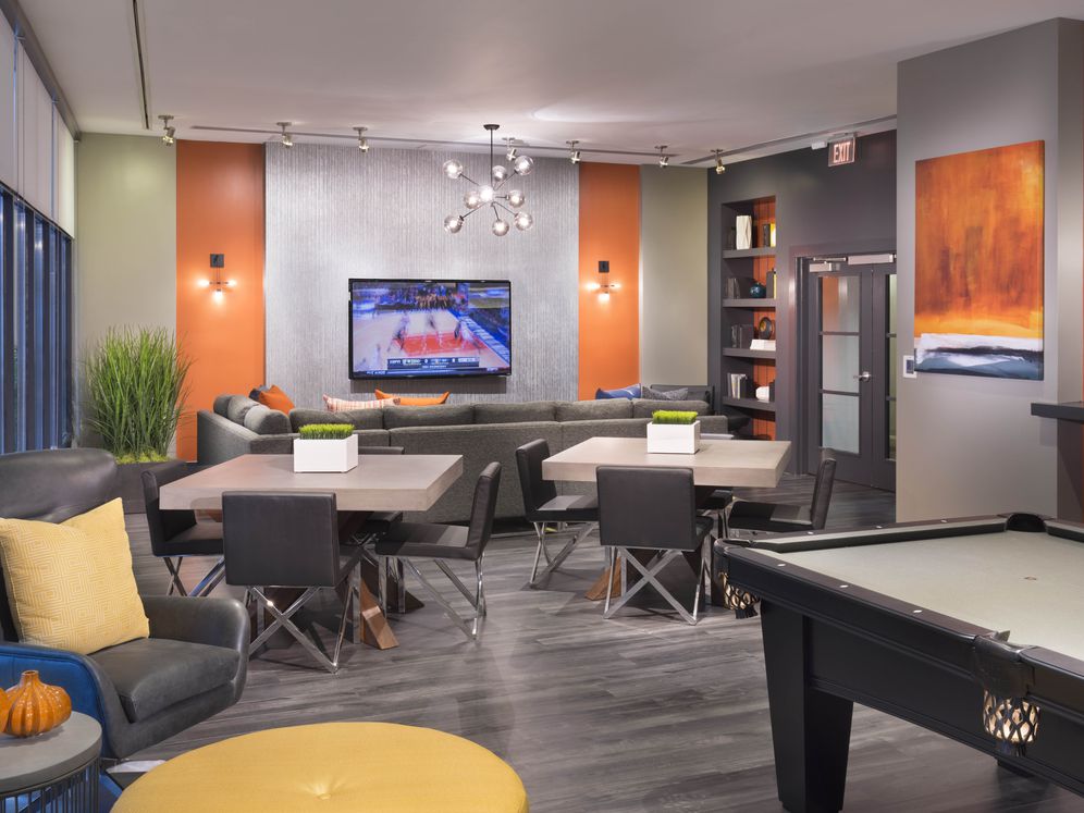 Resident lounge with billiards, lounge seating and flatscreen TV