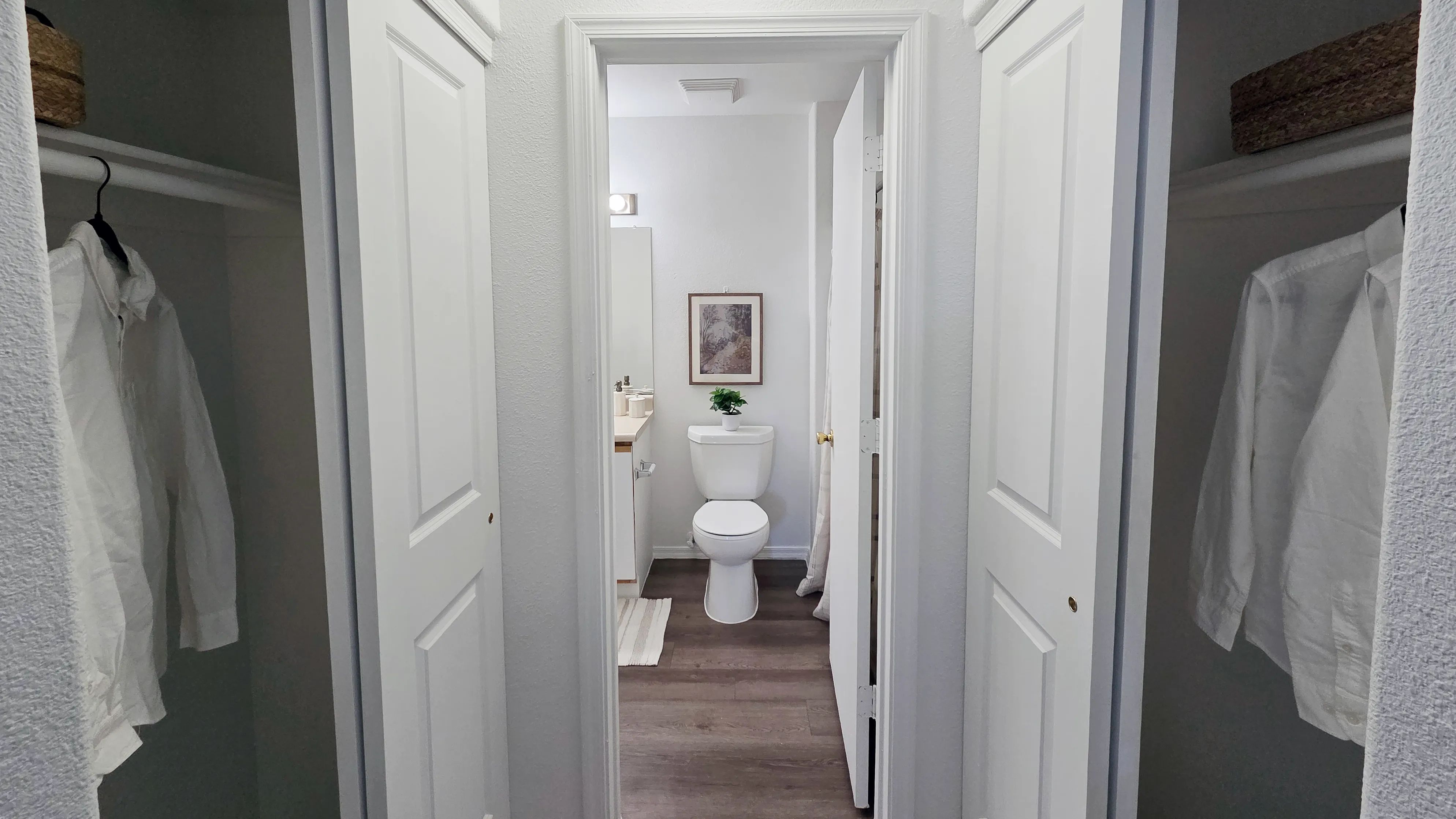 Enjoy the convenience of dual closets leading to a spacious bathroom, creating a private, organized suite designed to simplify your daily routine.