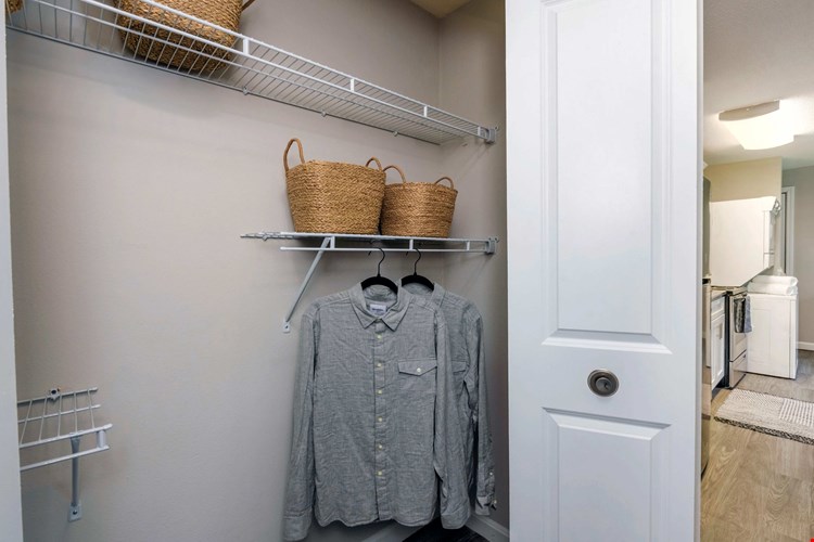 Step into a world of organized bliss with our roomy closets featuring built-in wire organizers. Discover stress-free apartment living.