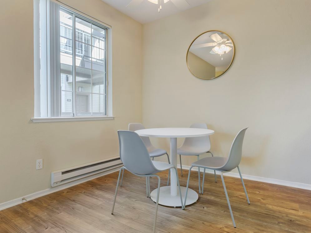 Furnished+ apartment homes include a dining set (Representative Image – exact items and style of furnishings may vary)