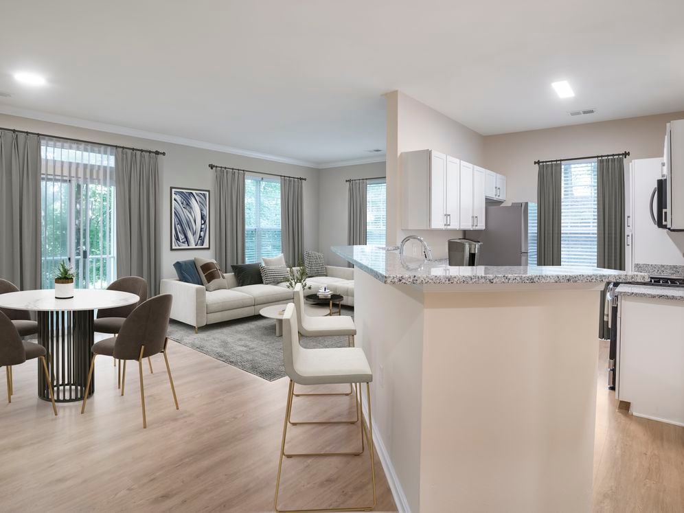 Renovated Package II kitchen and living room with hard surface flooring