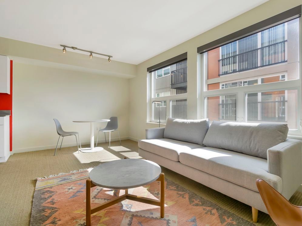 Furnished+ apartment homes include a dining set (Representative Image – exact items and style of furnishings may vary)