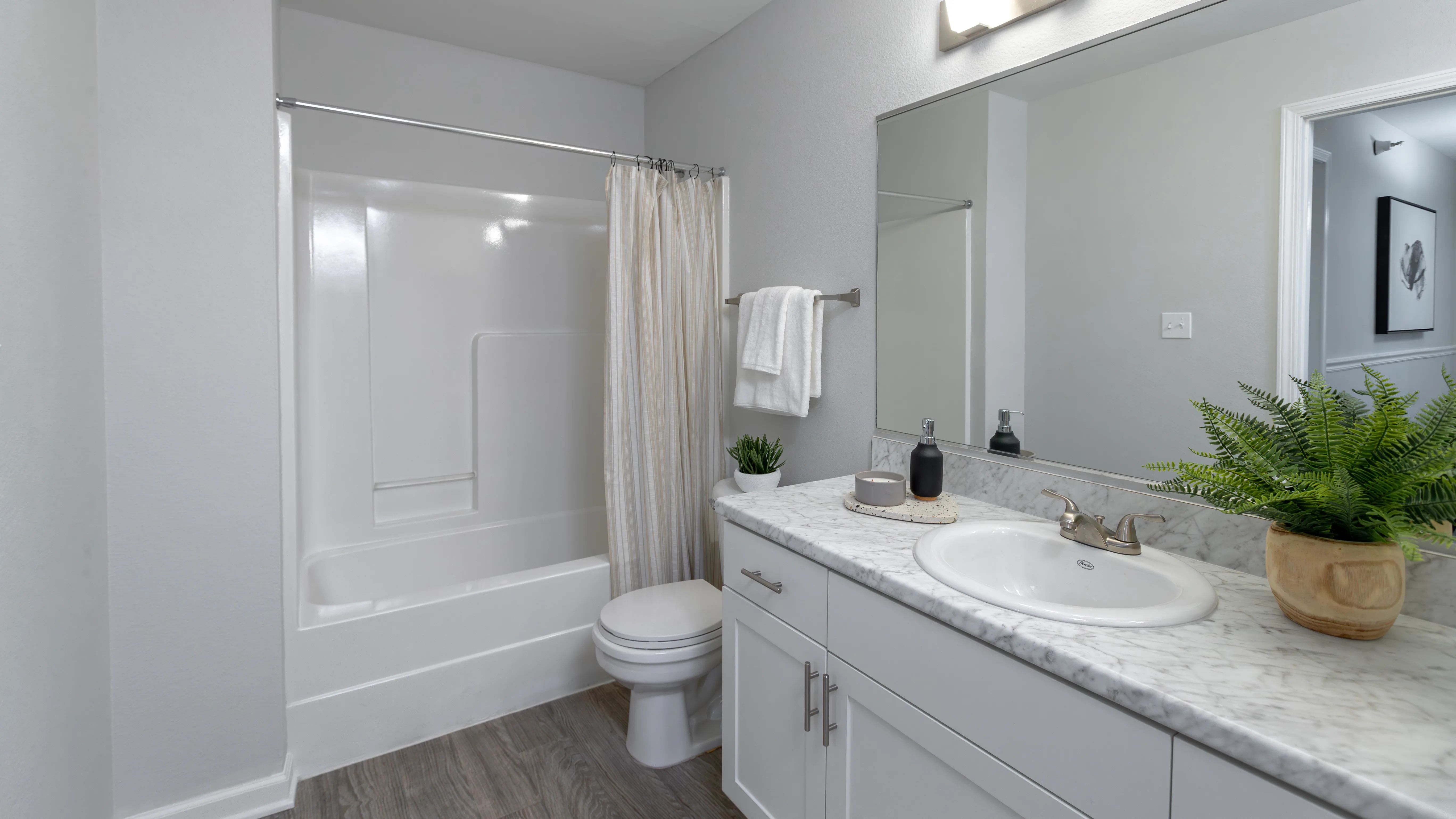 Delight in a chic updated bathroom that's a reflection of luxury.