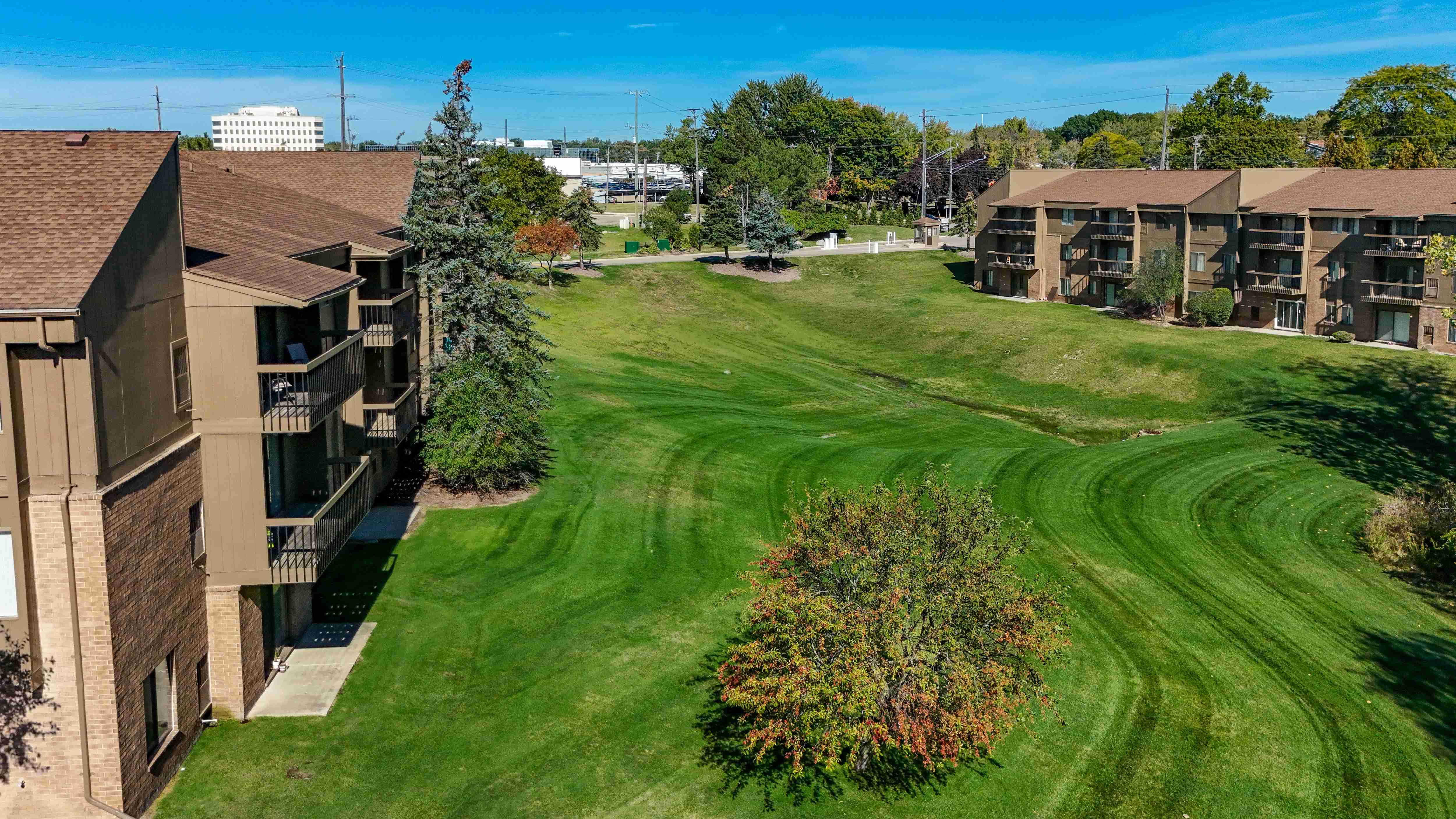 Expansive Green Space Apartment Building Exterior at Franklin River Apartments, Southfield, MI