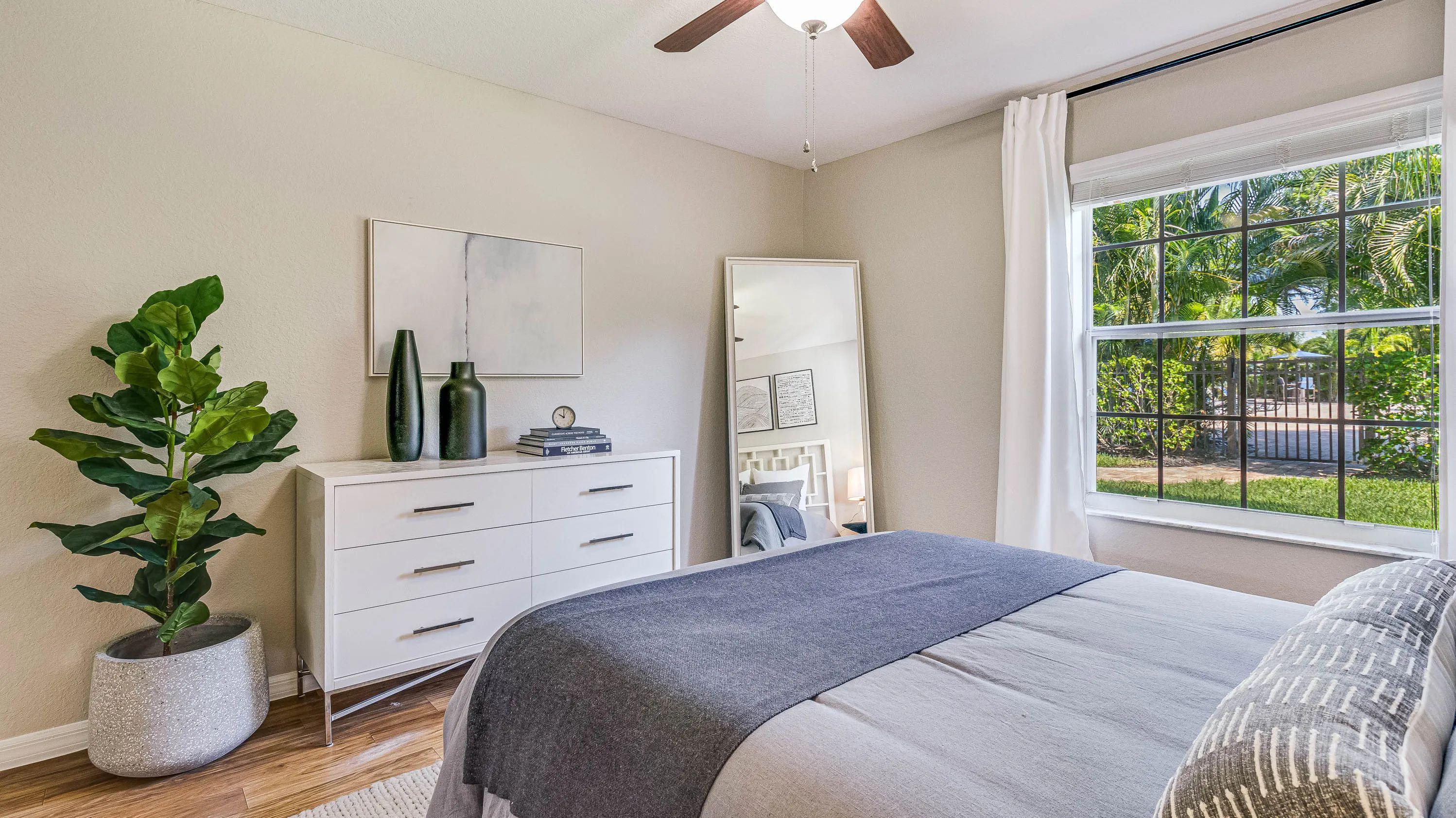 Each bedroom includes a multi-speed ceiling fan and large window. 