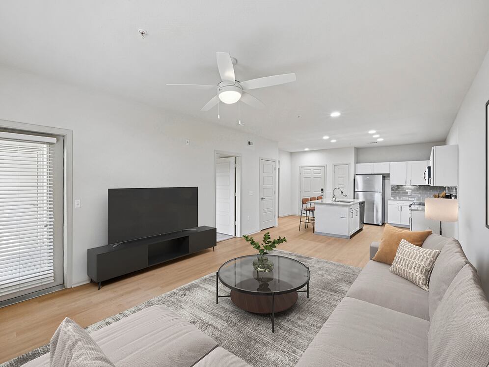 Renovated Package I living room with hard surface flooring