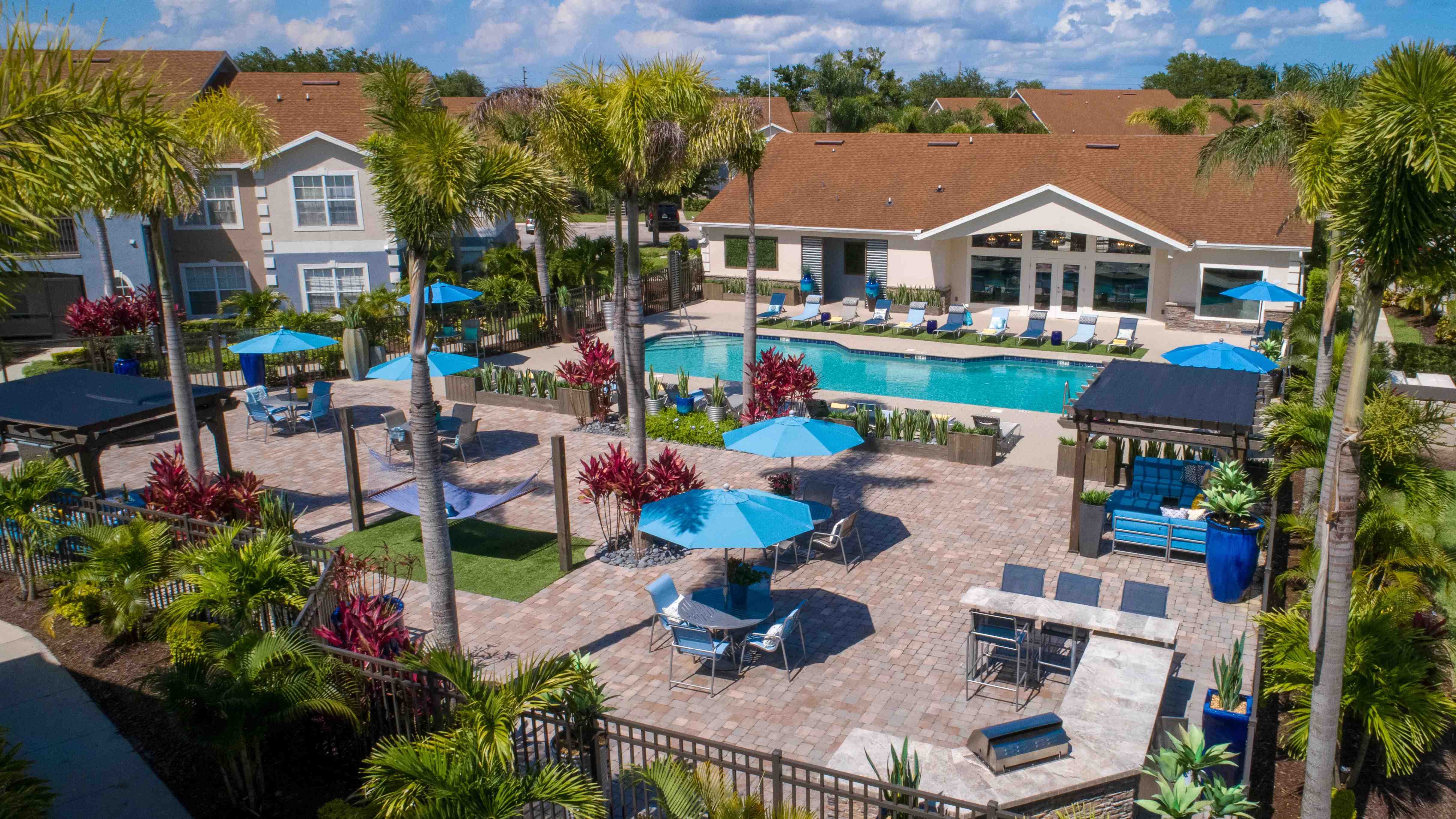 Dive into our poolside oasis, where the expansive sundeck and serene surroundings create the perfect at-home relaxation spot for your weekends.