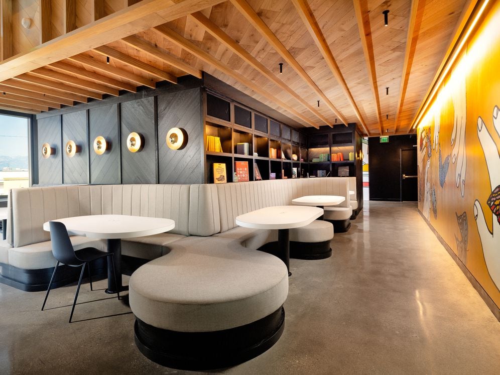 Lobby lounge with multiple seating areas and work-from-home spaces