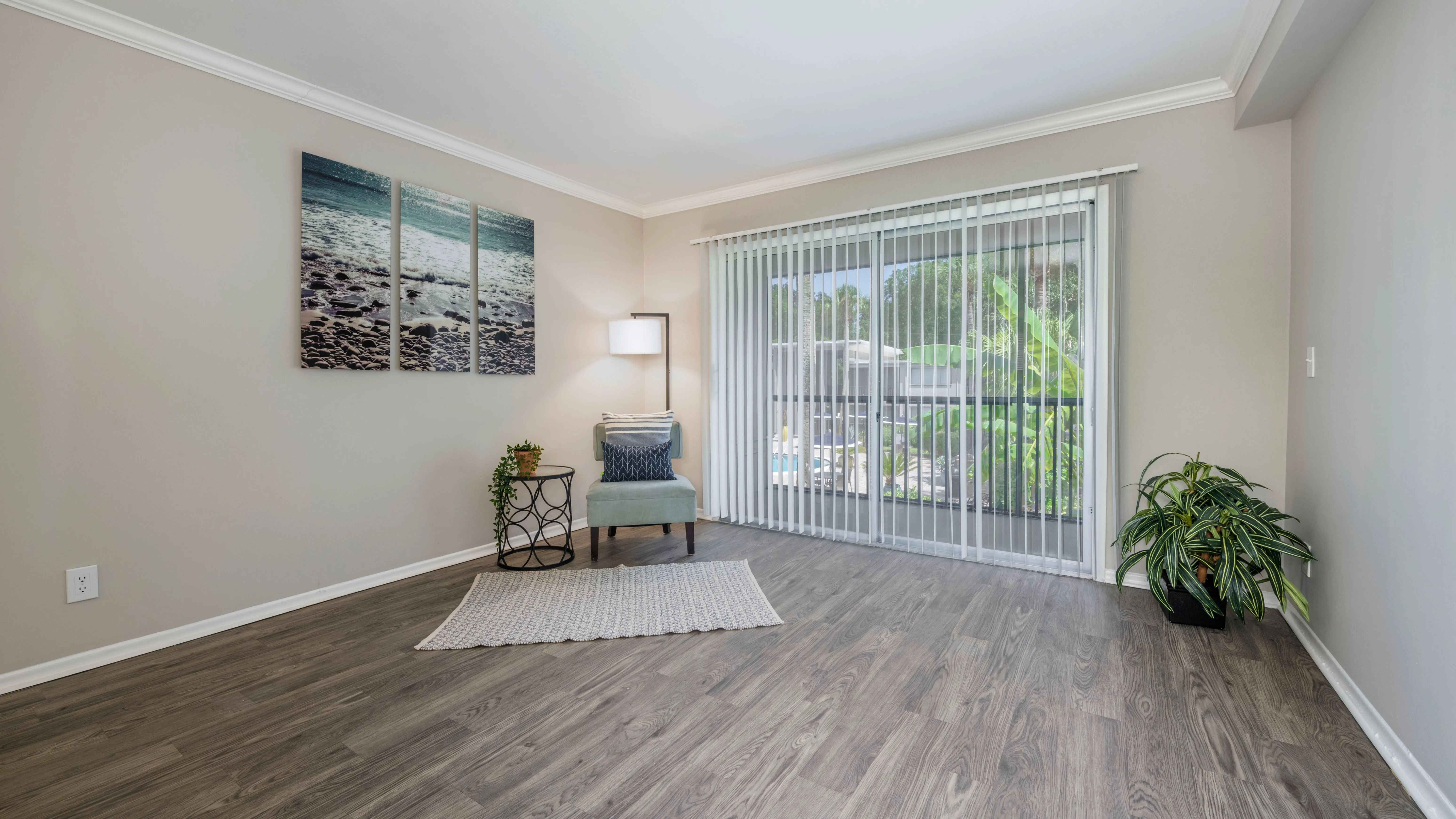 Immerse yourself in the enchantment of spacious living rooms adorned with warm wood-style flooring and inviting sliders that seamlessly connect to your private patio oasis - promising indoor-outdoor bliss. 