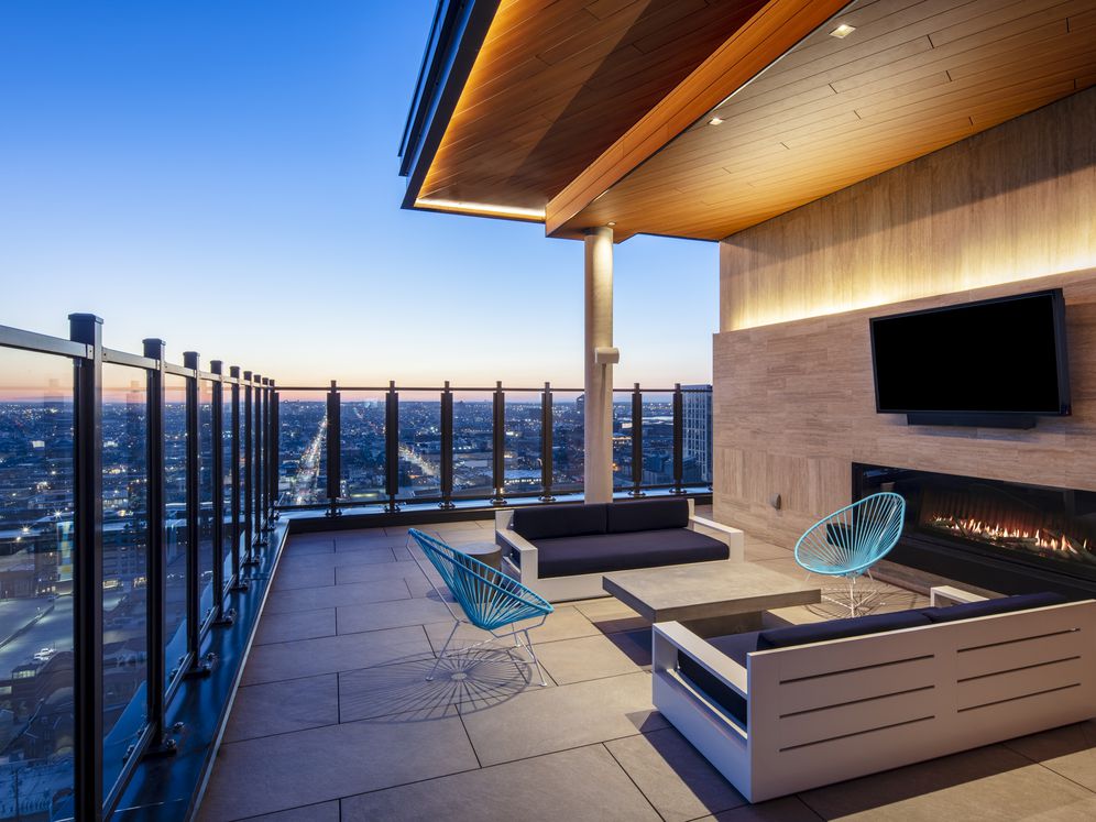 24th floor lounge area with fireplace and TVs