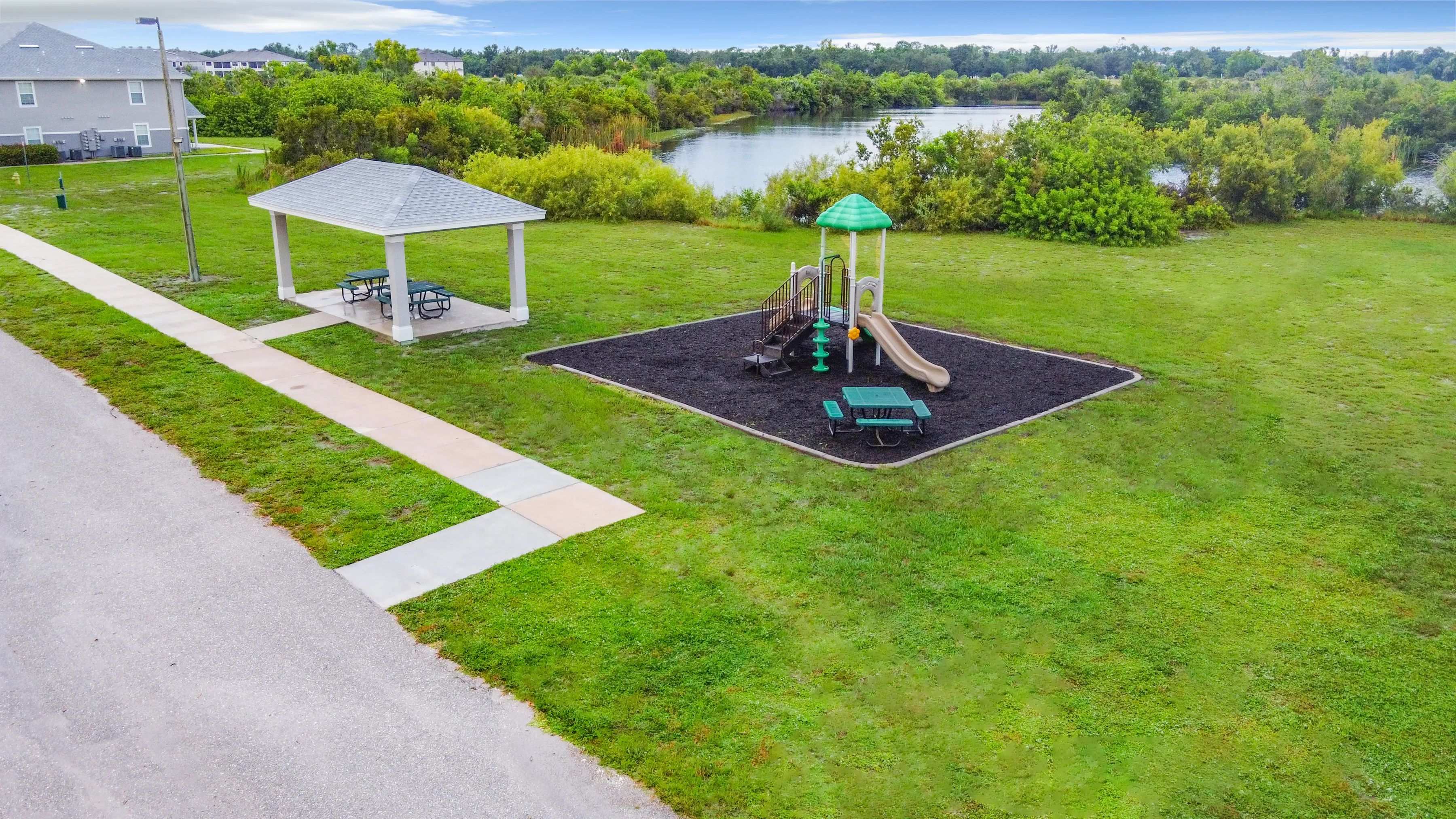 Step into a world of playtime bliss and picnic joyfulness at Charleston Cay's Playground and Picnic Area. 