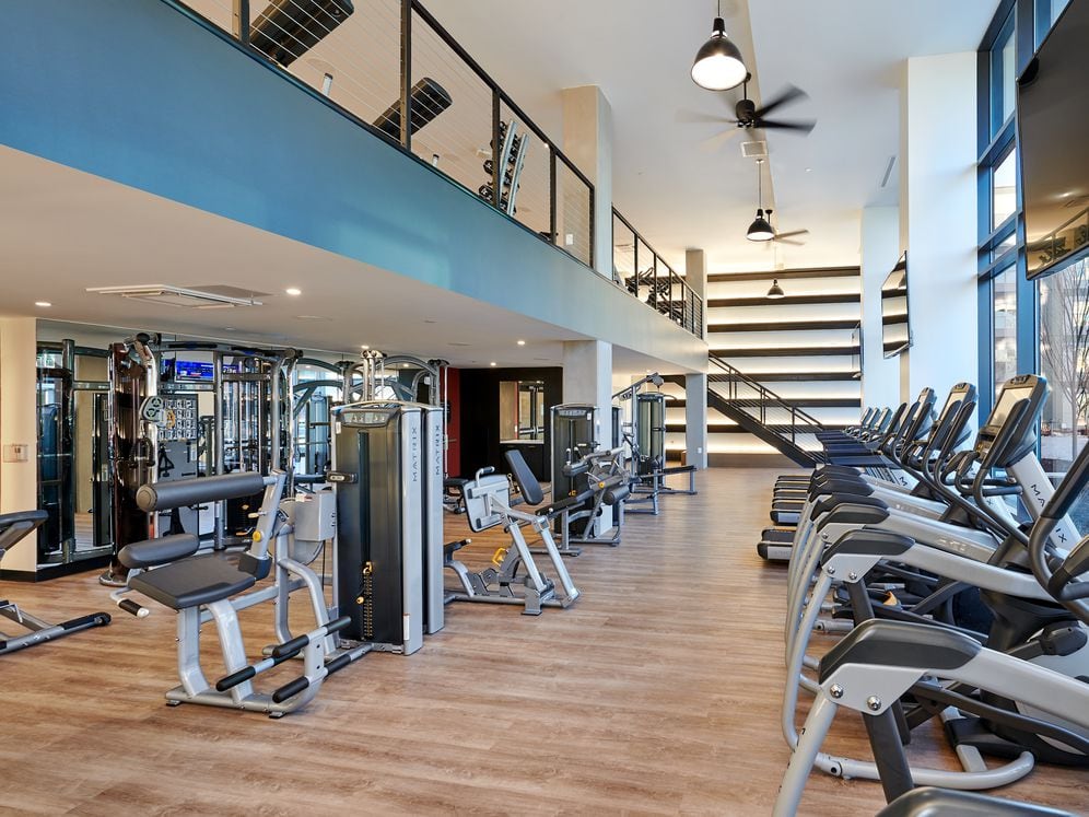 Two-level fitness center with cardio and strength equipment