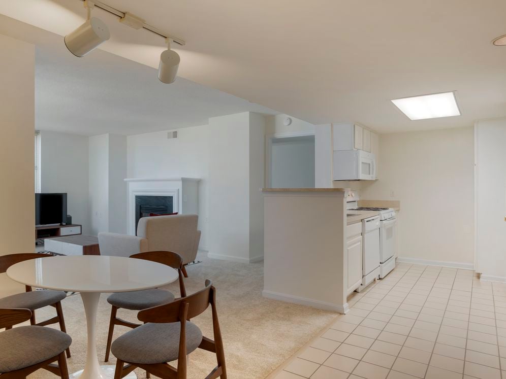 Furnished+ apartment homes include a dining set (Representative Image – exact items and style of furnishings may vary)