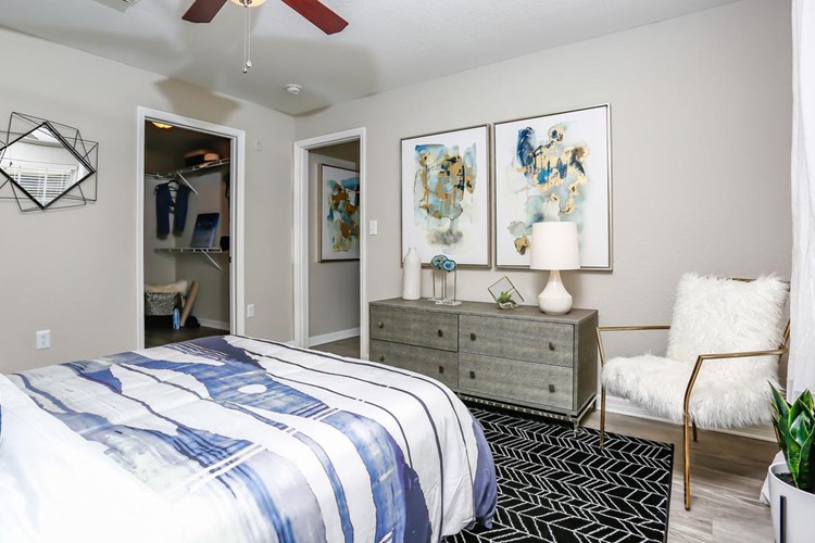 Spacious master bedrooms featuring a multi-speed ceiling fan.