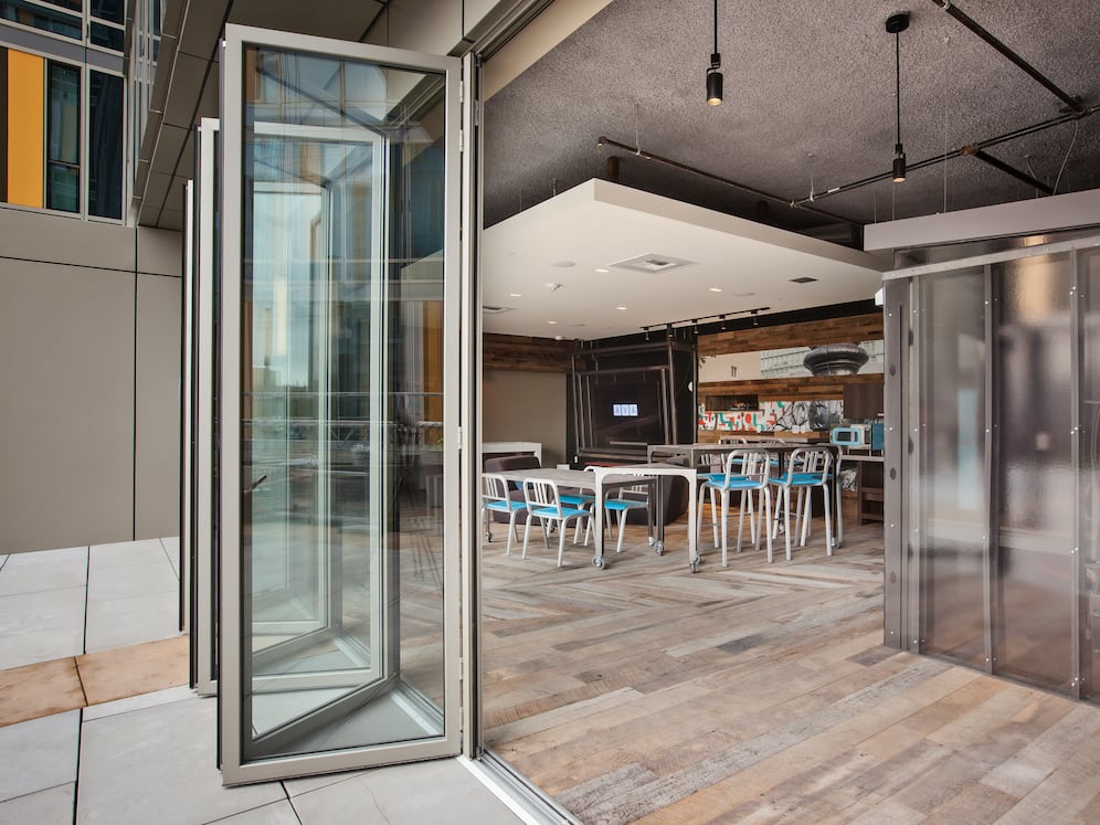 Chill lounge with workstations, common area seating and patio access