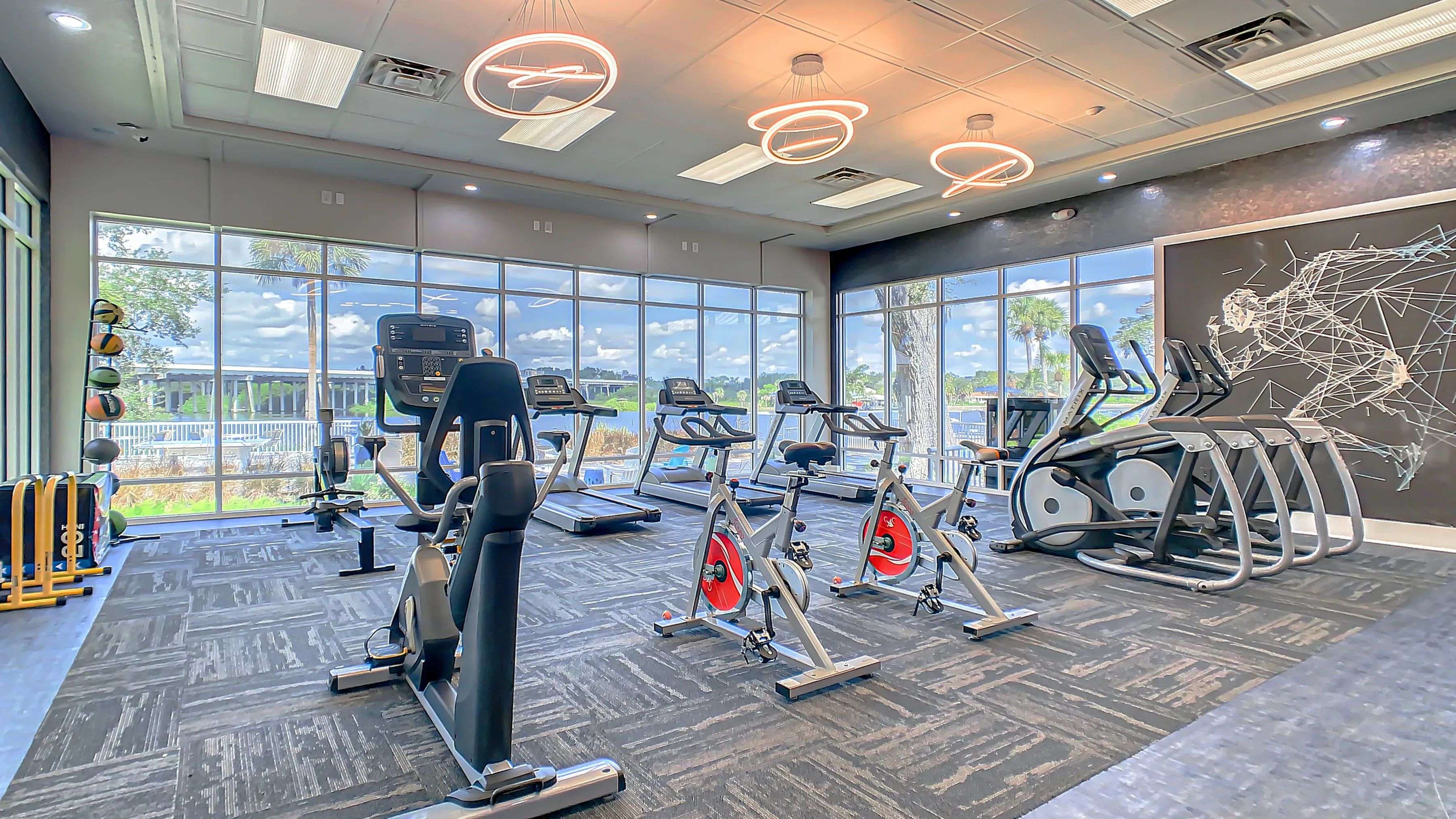 The tantalizing pool and river views seen from the resident fitness center infuse each workout with inspiration, creating an energetic haven for wellness seekers.