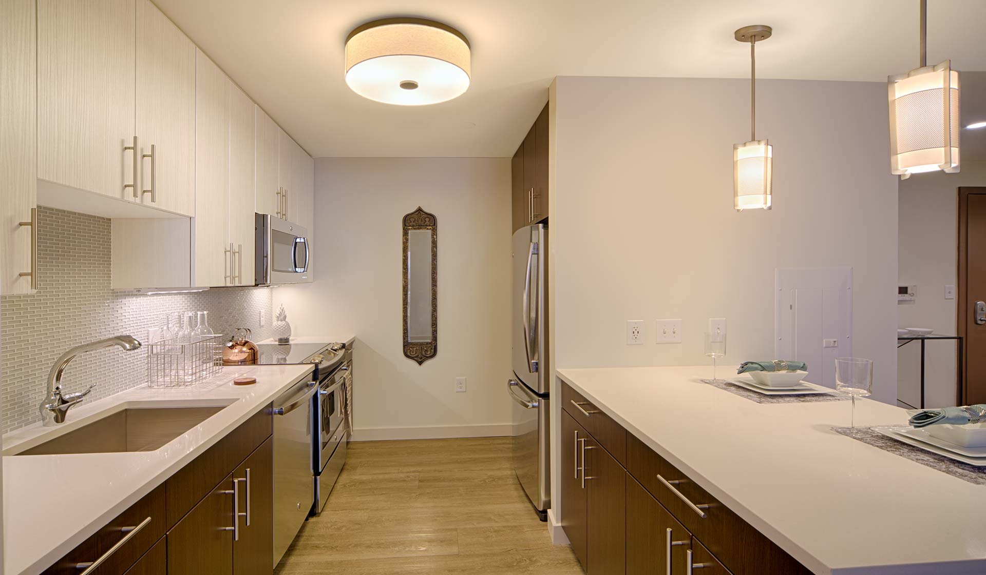 Large, modern kitchen with breakfast bar and designer cabinets 