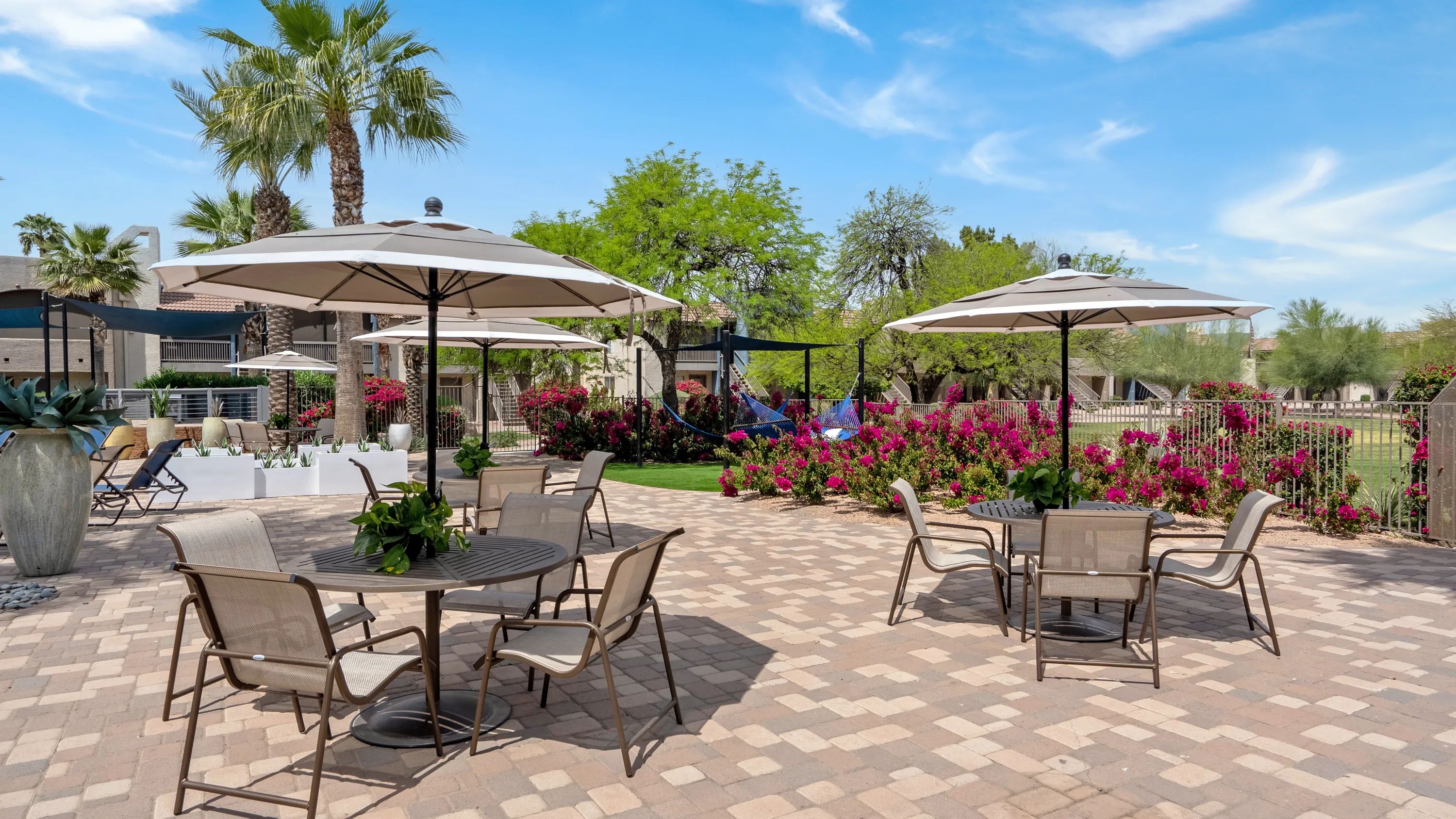 Indulge in the luxury of al fresco dining on our sun deck, featuring umbrella-covered tables and chairs for your exquisite dining experience. 
