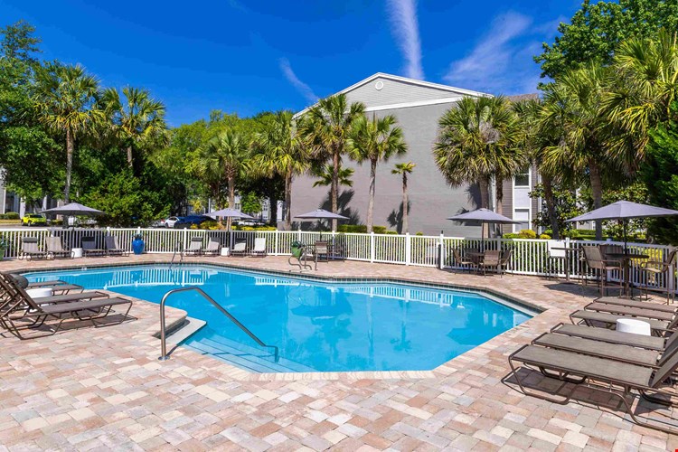 Our resort-style pool features shaded seating, modern loungers, and a beautifully landscaped sundeck that’s perfect for relaxing or entertaining.