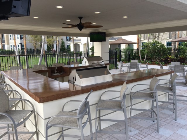 Gazebo with gas grills and 4 TV's.