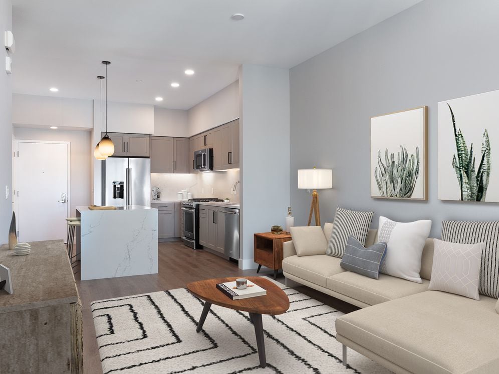 Signature Collection living and dining area with hard surface flooring 