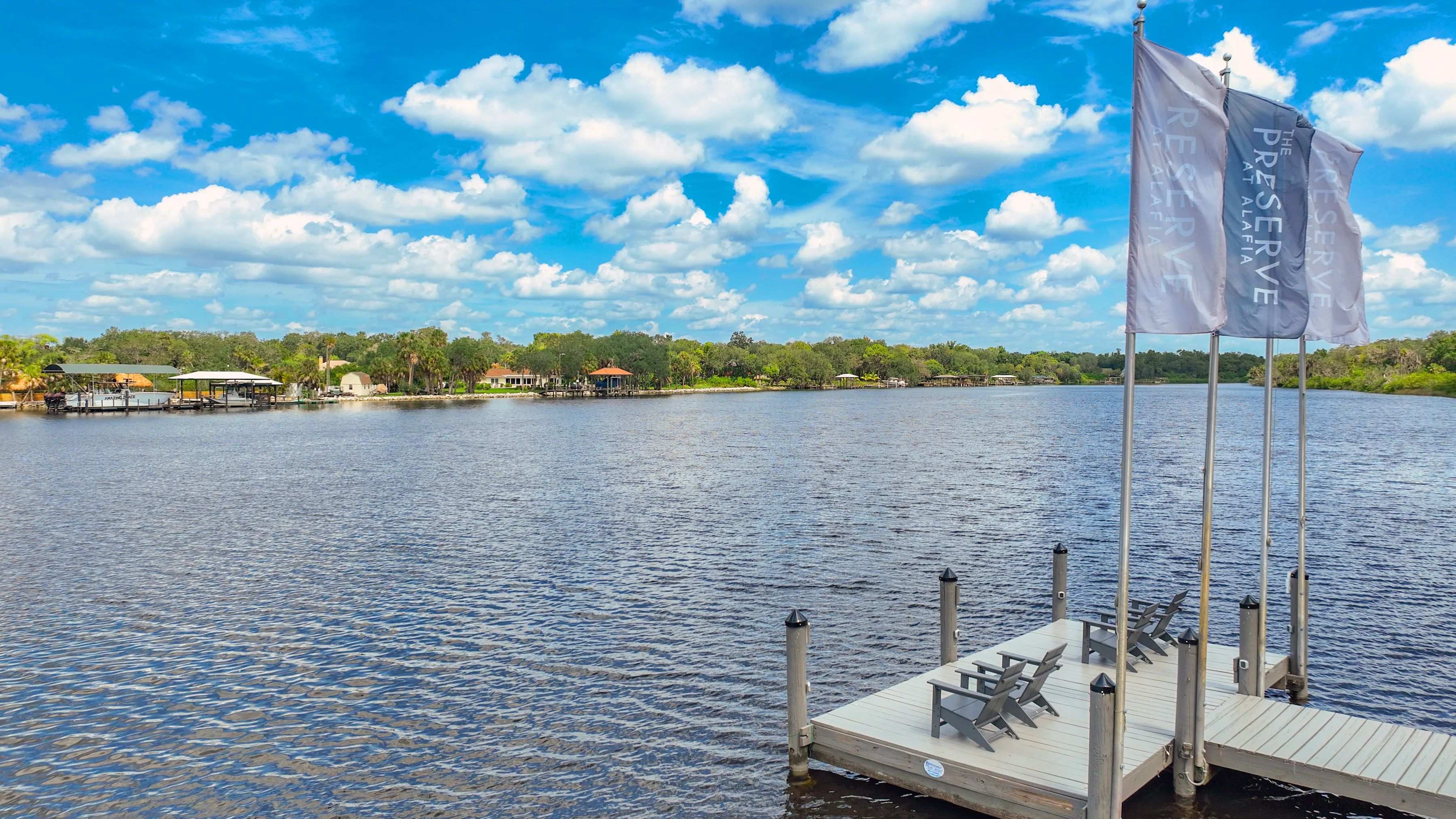 This inviting spot offers tranquility, where residents can unwind while casting a line or simply bask in the serene waterscape on the river.