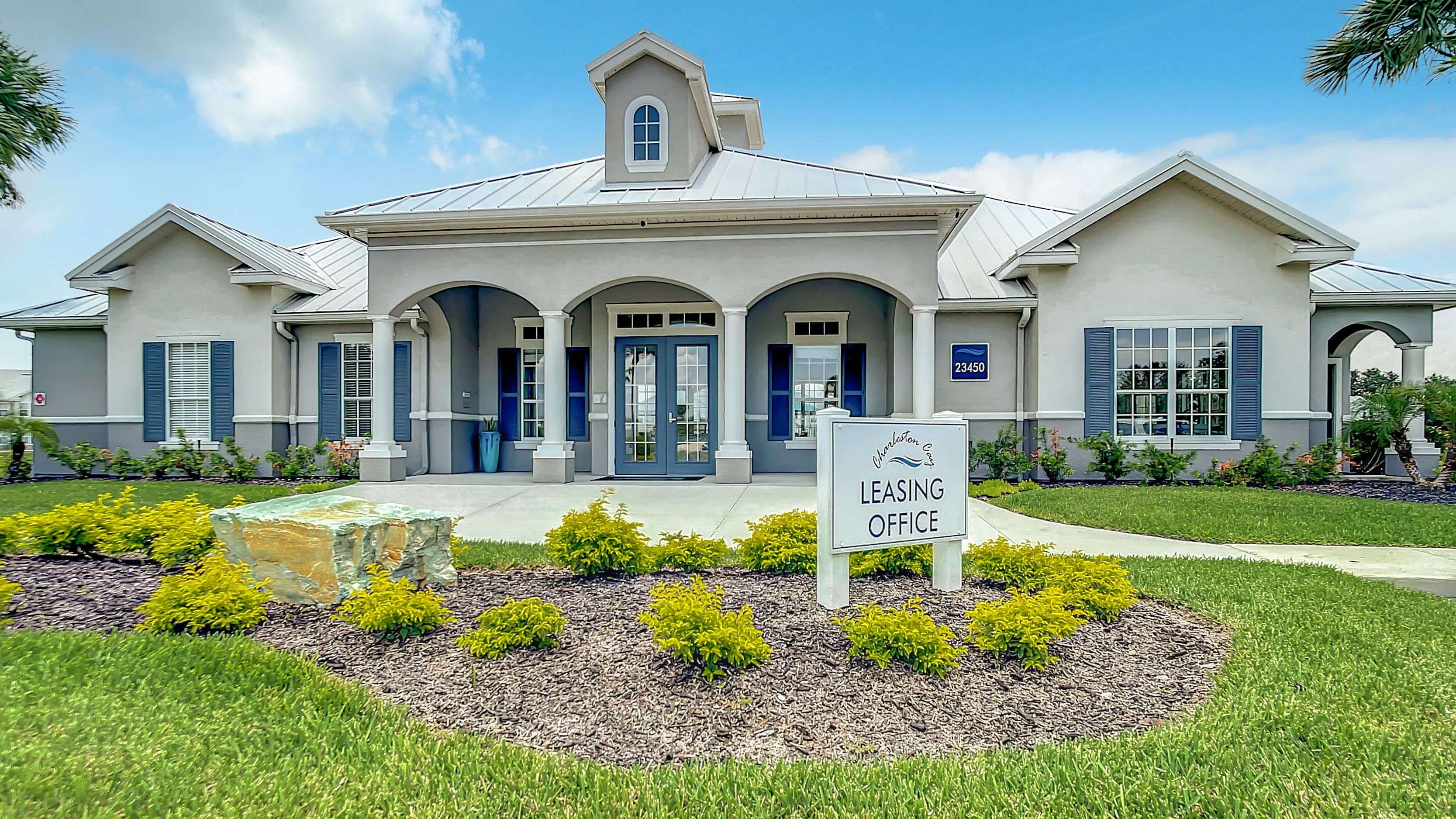 Embark on a journey to discover your next home at Charleston Cay's leasing center entrance, a gateway to elegance and comfort.