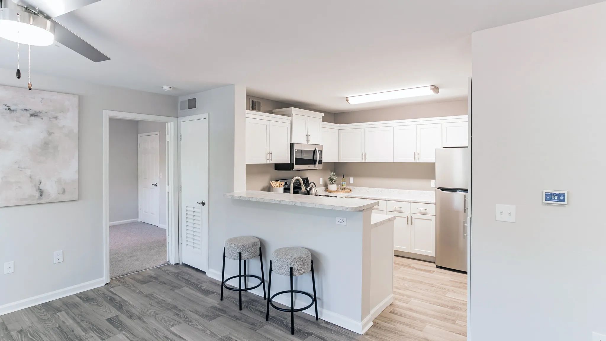 Indulge living in this stunning kitchen oasis boasting ample cabinetry and a versatile breakfast bar overlooking the living area for the ultimate in convenience and style.