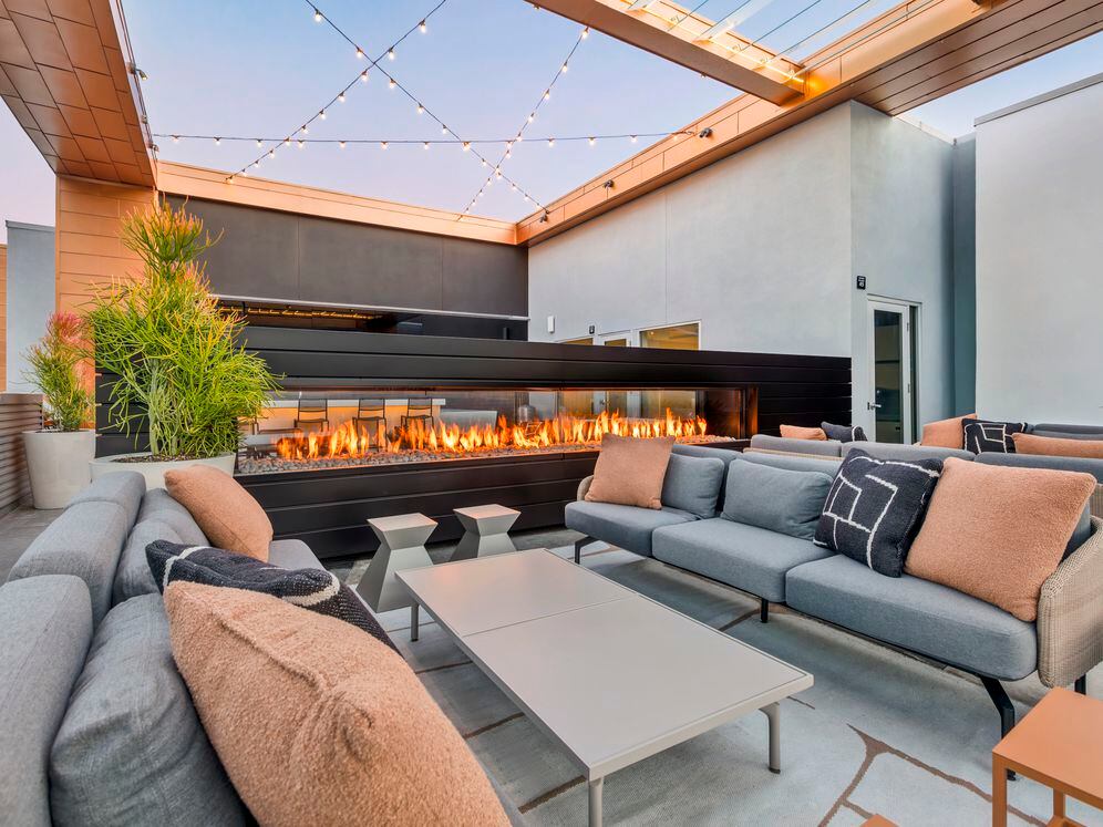 Rooftop with fireplace and lounge seating