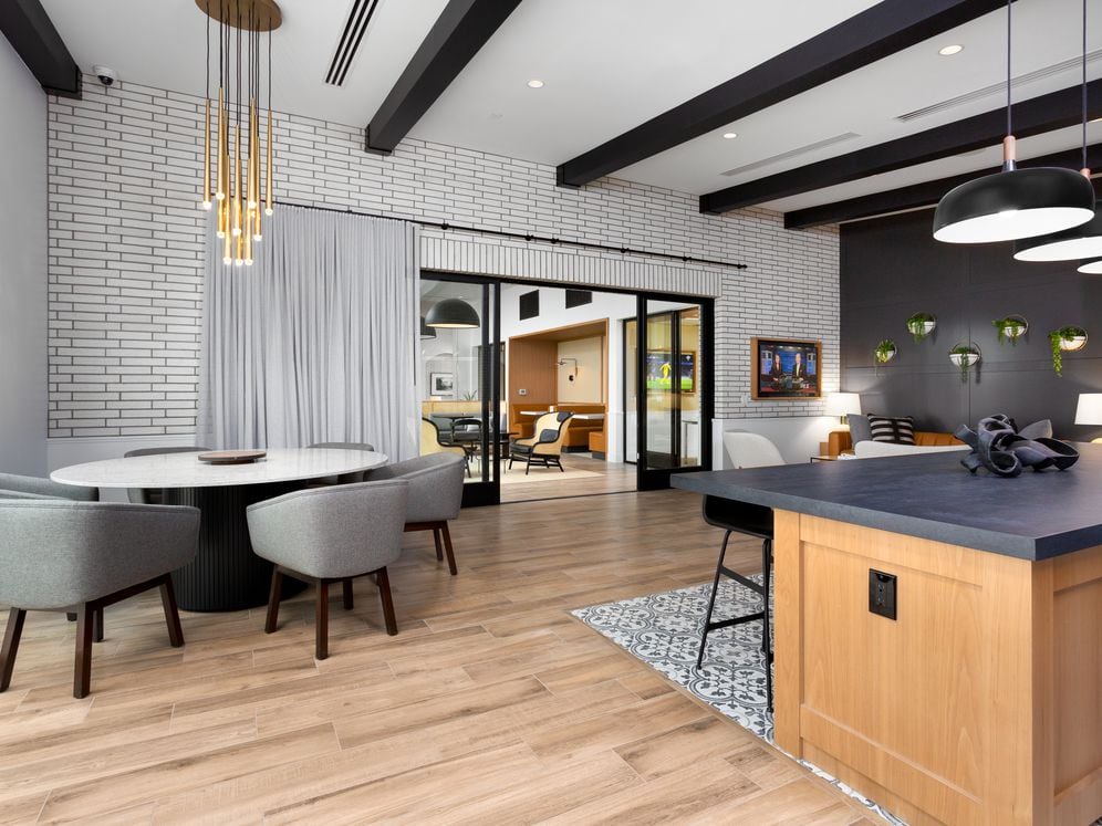 Resident lounge with seating and dining areas