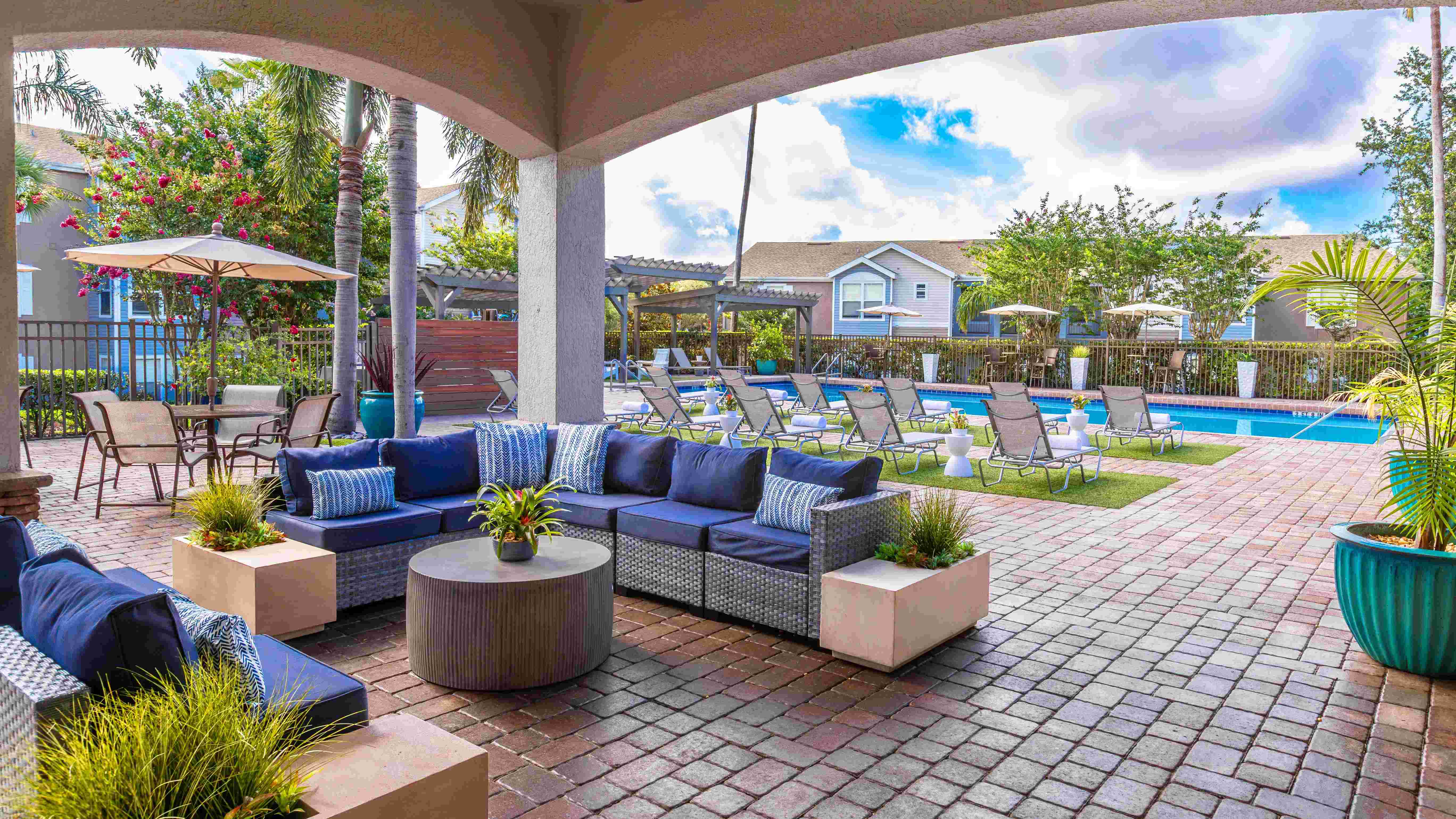 Unwind in style under our shaded outdoor lounge—perfect for relaxing with friends or escaping the Florida sun.
