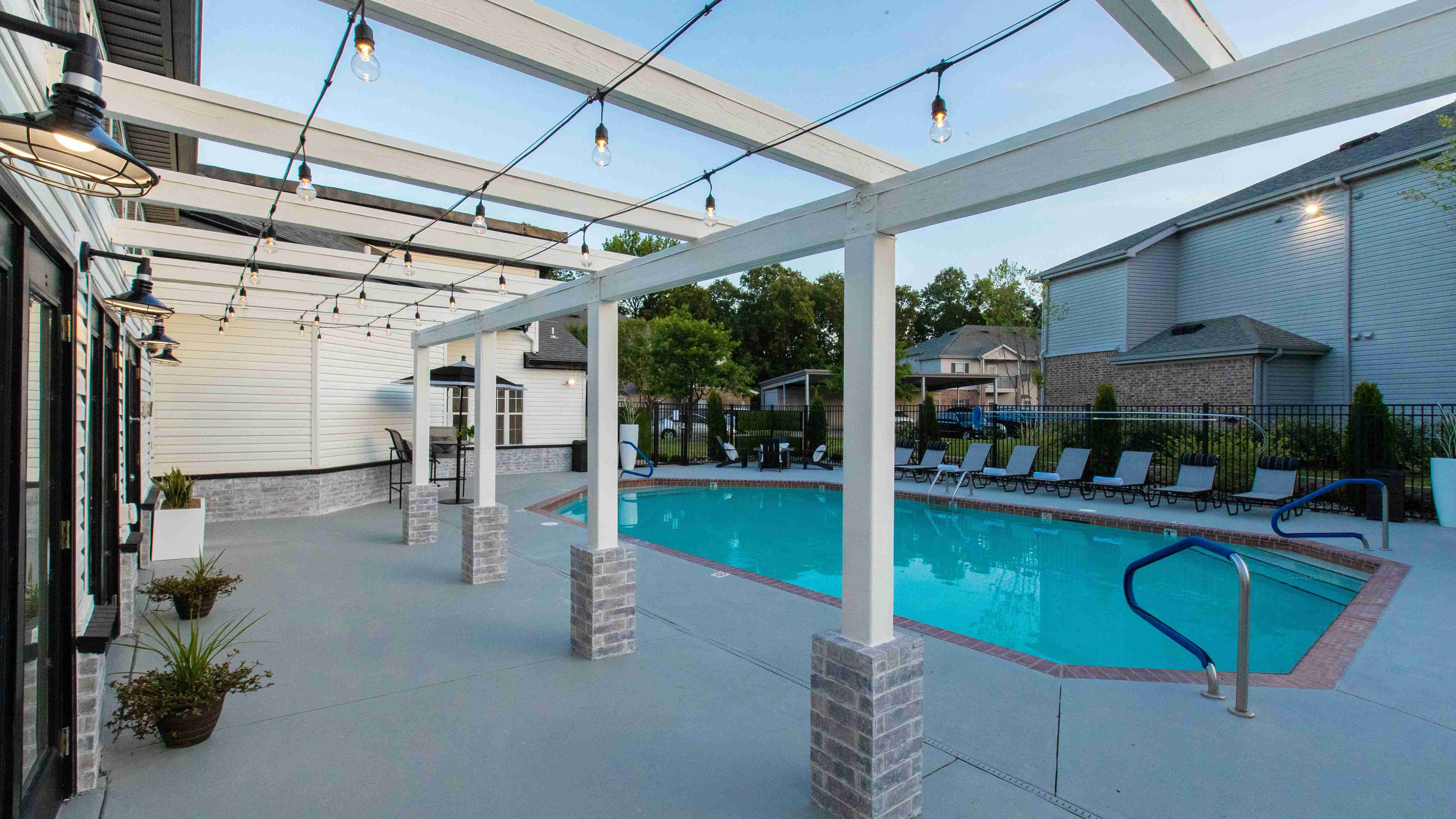 Experience the allure of bistro lighting by the pool after dusk, casting a romantic glow and setting the stage for a magical nighttime ambiance.