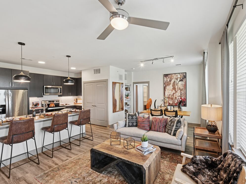 Kitchen, living, and dining area with hard surface flooring