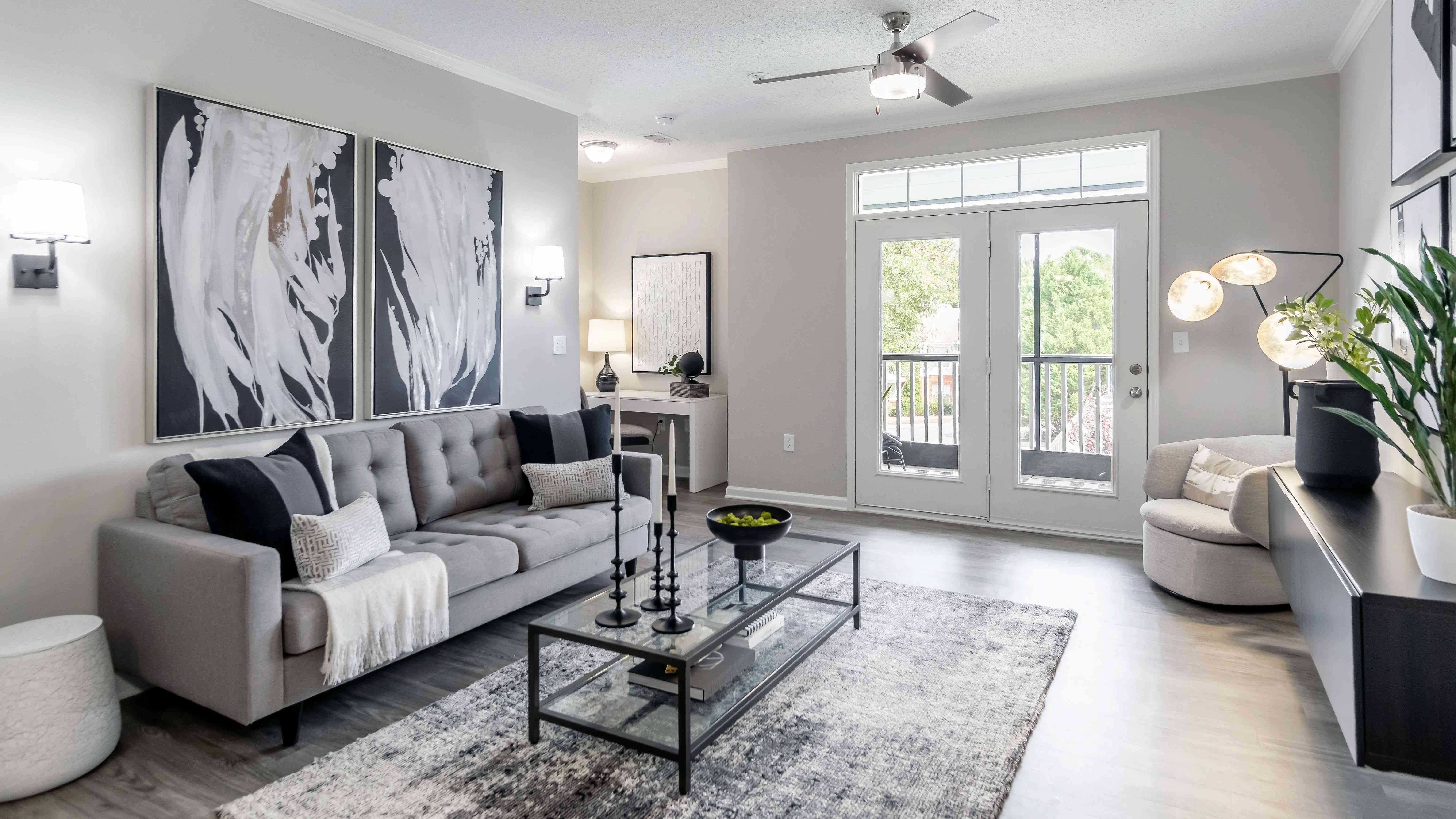 Embrace the best of both worlds in our spacious living room with access to a serene, screened patio. (In select units)