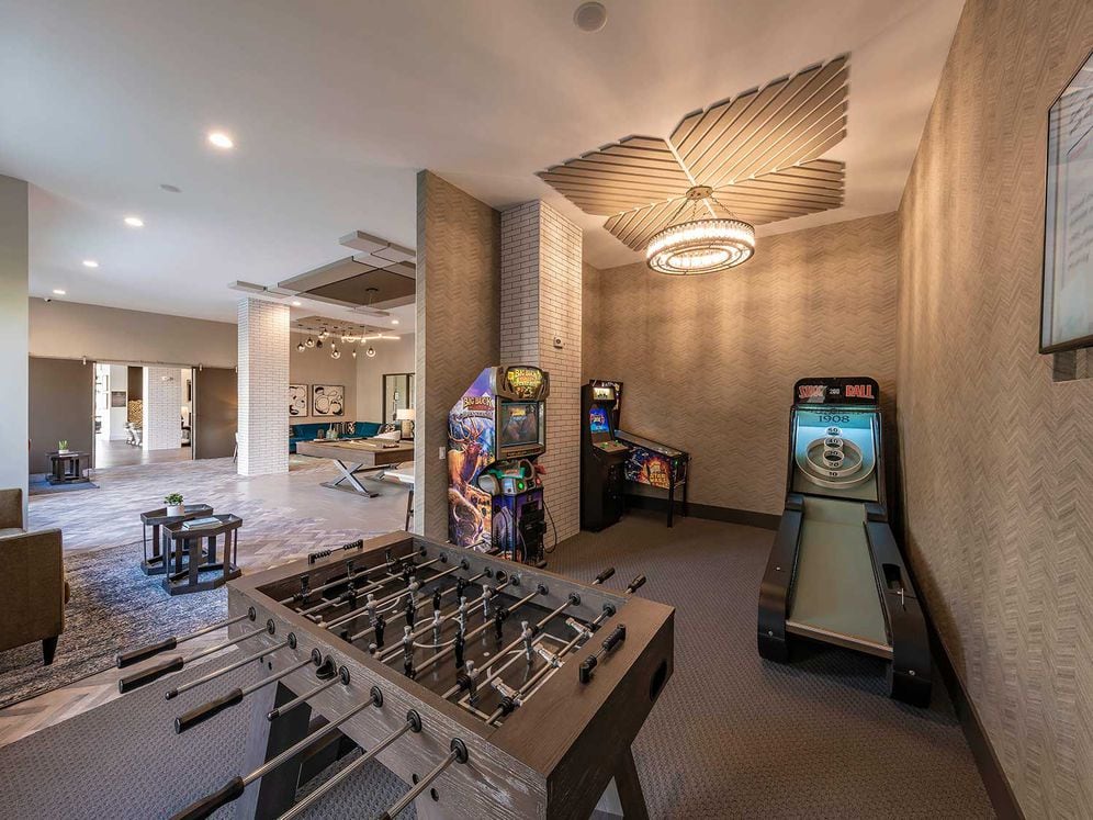 East building resident lounge with foosball table and arcade games