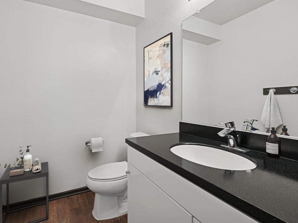 Bath with hard surface flooring