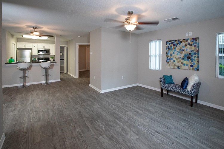 Your spacious living room opens up into the kitchen.