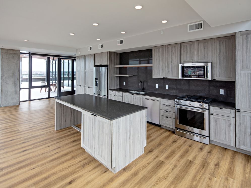 Penthouse-level Signature Collection apartment homes feature kitchens with upgraded finishes and appliances