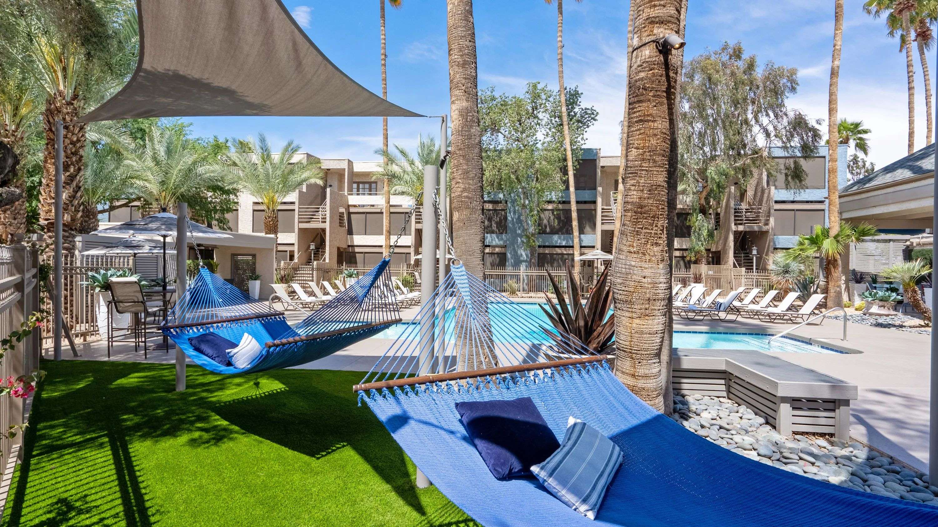 Drift away in a blissful slumber, nestled in the poolside hammock garden under swaying palms. Find your joy on our expansive pooldeck! 