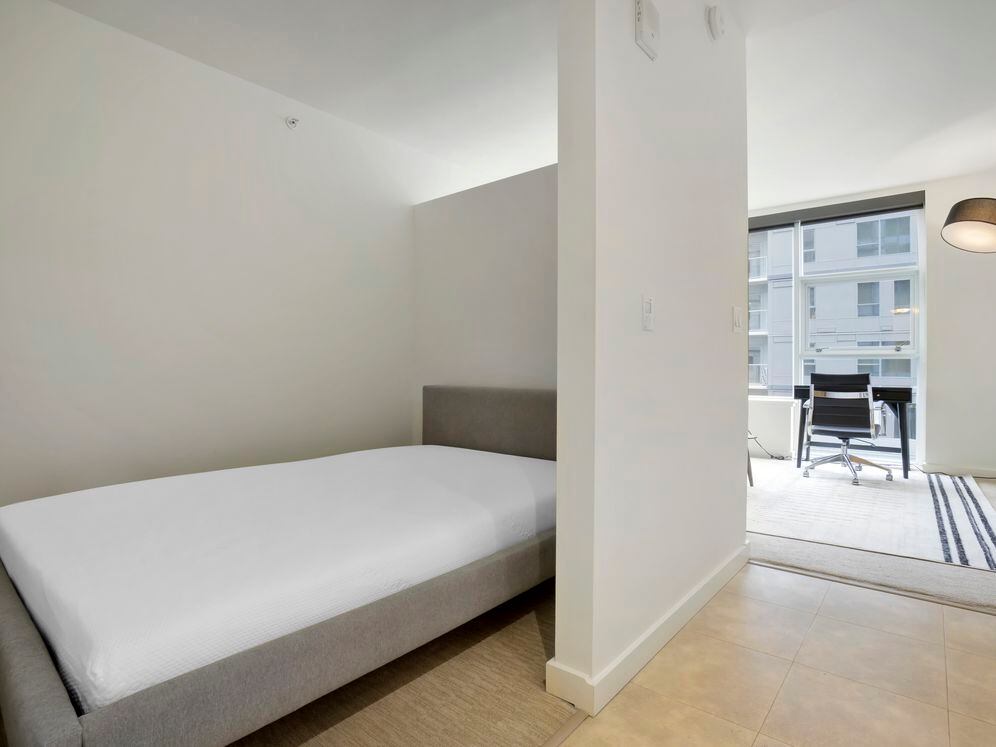 Furnished+ apartment homes feature a queen bed with mattress (Representative Image – exact items and style of furnishings may vary)