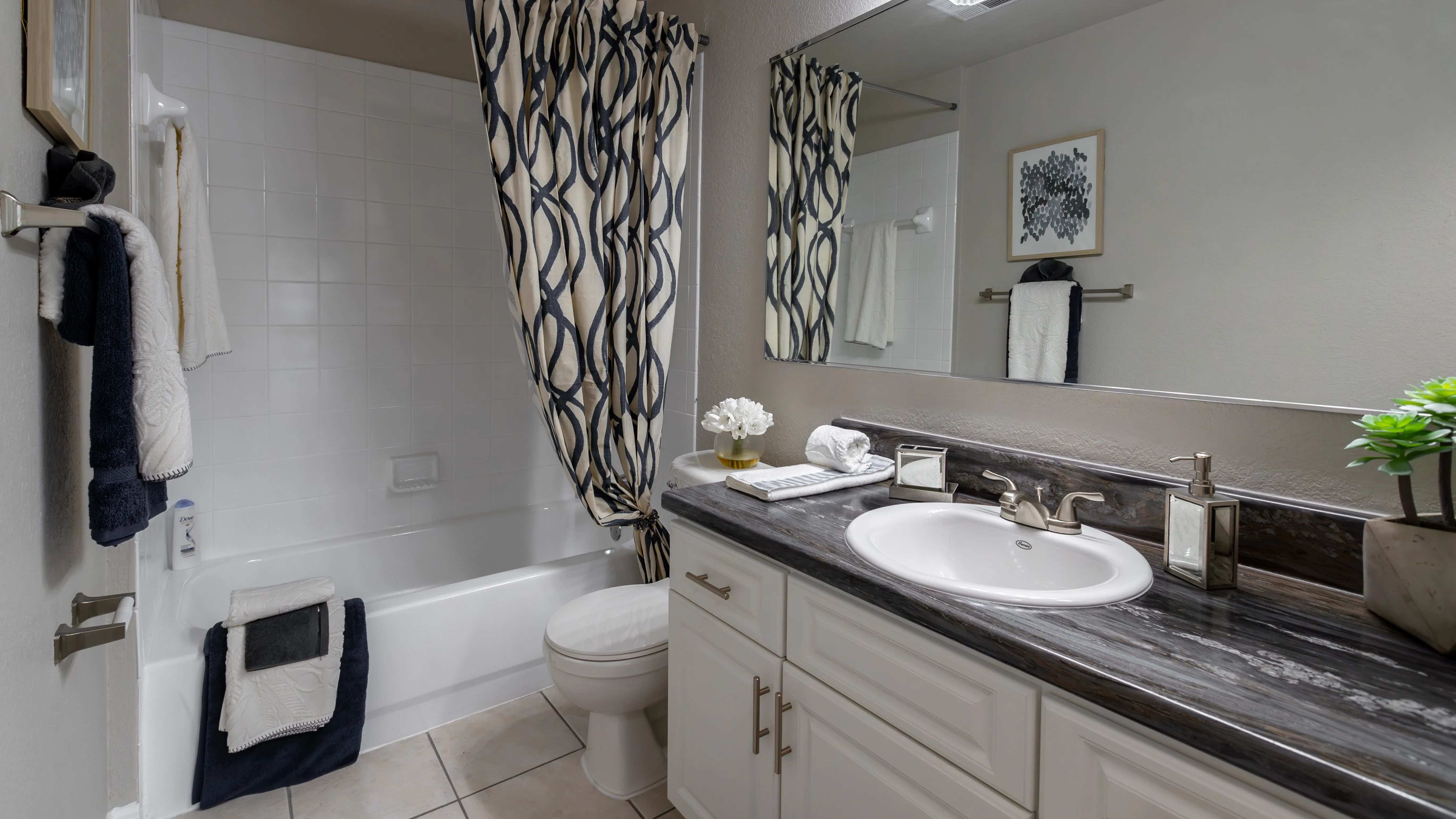Experience contemporary luxury in our brilliantly updated bathrooms, offering refined elegance and sleek design.
