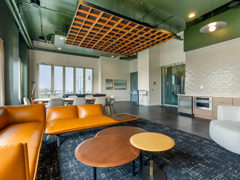 Resident lounge with coworking spaces and kitchenette